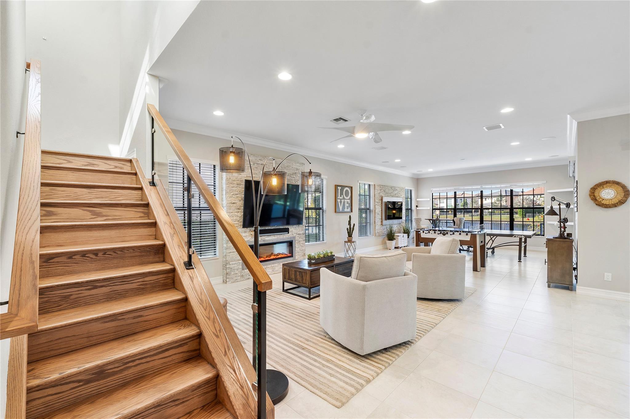 The seamless glass staircase with real wooden stairs & matching banister, such a unique and contemporary combination,