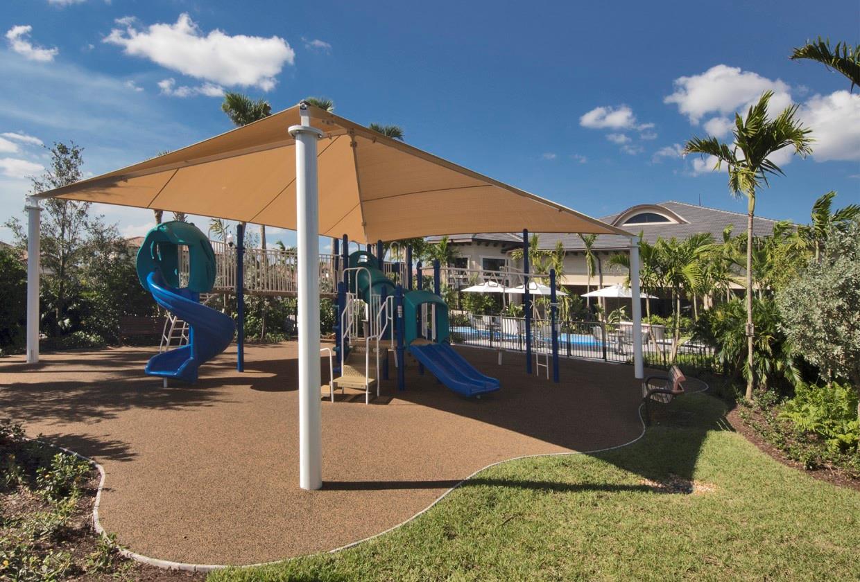 This is a shaded playground for children inside the double fenced clubhouse that we call the Pierhouse, If you zoom in you can see the waterpark right next to it, Have your children run across the tiles jetted floor to press the button and they have to get back before the jets come on,(an impossible task) but lots of fun, on this side of the playground there is a completly shaded BBQ & wine area for the grown ups, kids can play and adults get to hang out with their neighbors, cook and be merry,