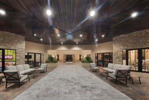 The Pierhouse (clubhouse for Watercrest community) this is the entryway when you walk into the Pierhouse there are relaxing chairs to sit and watch your family swim and play in the huge open area of ammenities at the Pierhouse