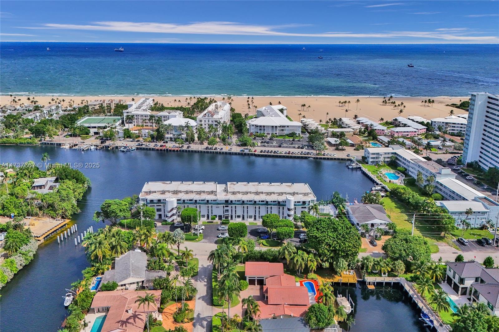 STUNNING 2430 S.F. DESIGNER WATERFRONT, BOATER'S DREAM, FULLY REMODELED 2 story HARBOR BEACH TOWNHOME. PRIVATE DEEDED BOAT DOCK. Unobstructed intracoastal view, steps to beach, epic ocean and Lake Mayan views. END UNIT. ONLY one with private pool access. 2 patios, primary balcony, all waterfront. 3 large bedrooms, primary sitting area. 2.5 large baths. Marble en suite primary bath, dual sinks, upgraded faucets. Gorgeous kitchen, eat in nook, high end appliances. Custom closets and draperies, remote blinds. Beautiful loft, easily converted back to 3rd bedroom. Removed to showcase glass staircase. Genuine wood upstairs, slate downstairs. High end lighting. New washer/dryer. Hurricane impact windows/doors. 1 assigned parking space, ample guest parking. Waterfront marble pool.