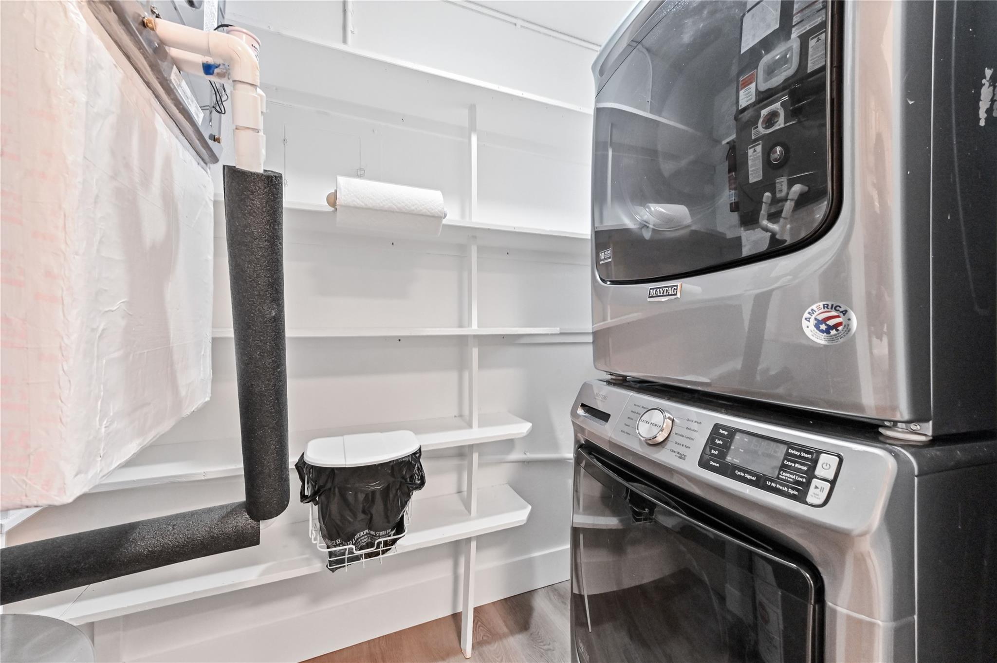 Laundry area adjacent to kitchen with full size Maytag Washer and Dryer.  Great pantry area too