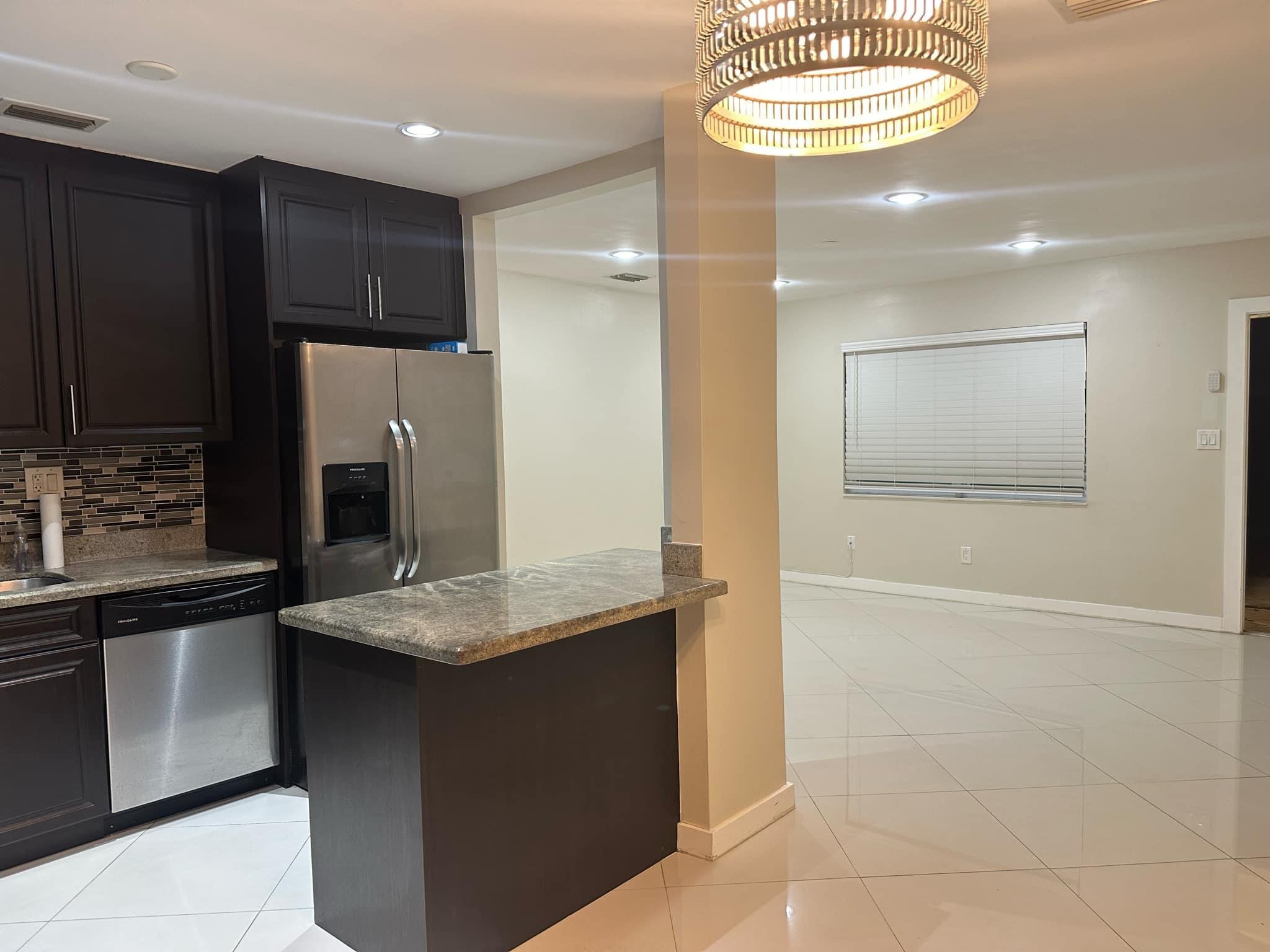 Main House Kitchen with view of Living Room