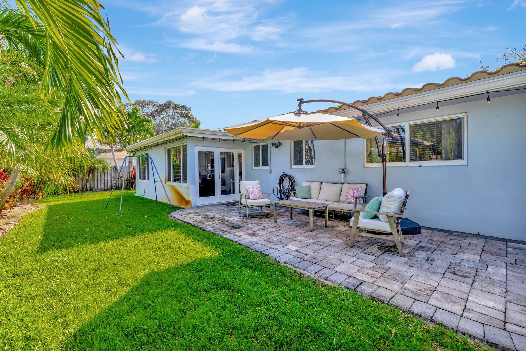 The tranquil fenced backyard that offers a perfect patio-to-yard a lot balance, ideal for entertaining or quiet relaxation.