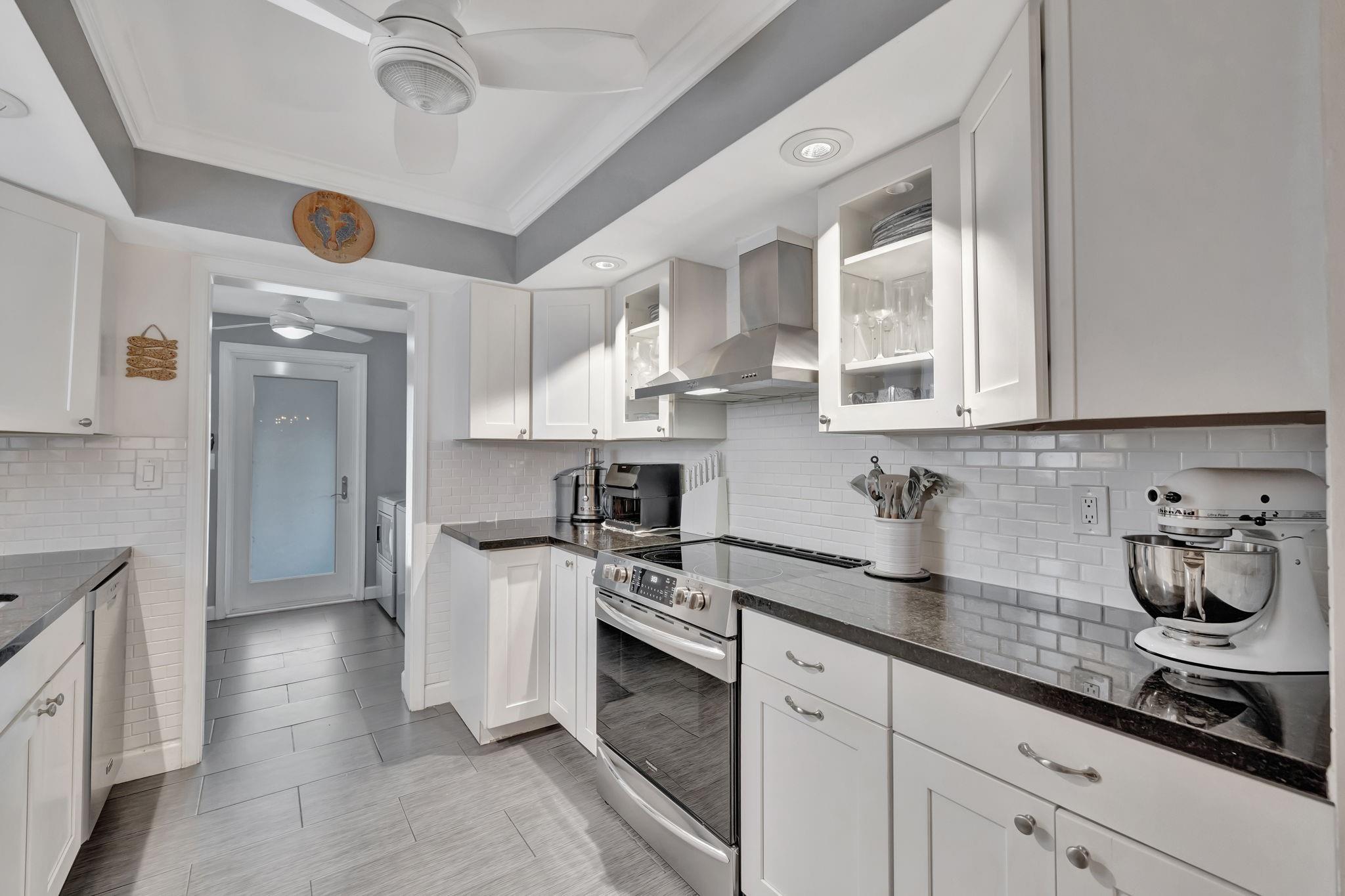 The Kitchen extends into a dual laundry room/butler’s pantry with access to the carport for added convenience.