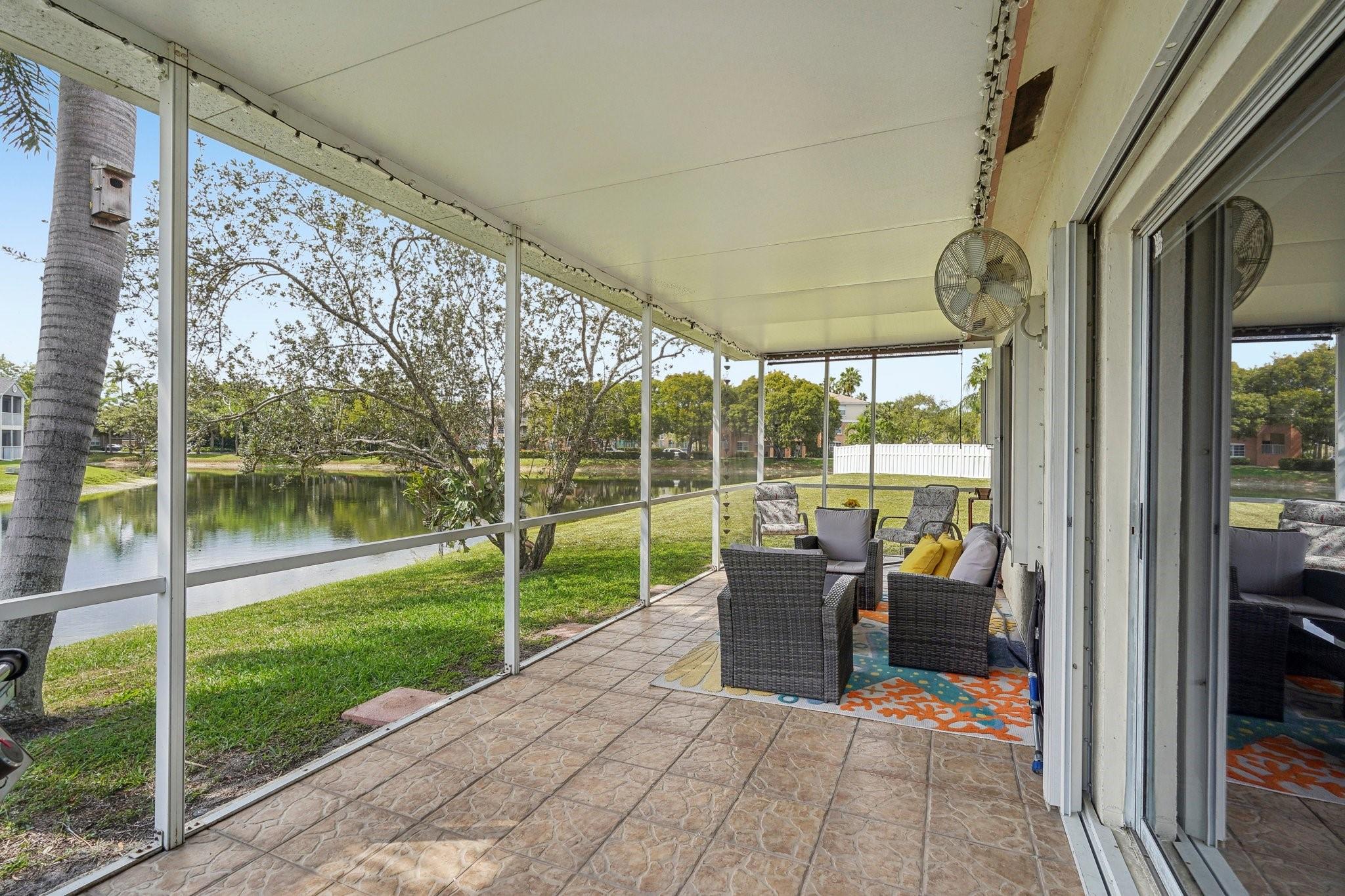 Enjoy a large covered and screened in patio overlooking a serene lake.