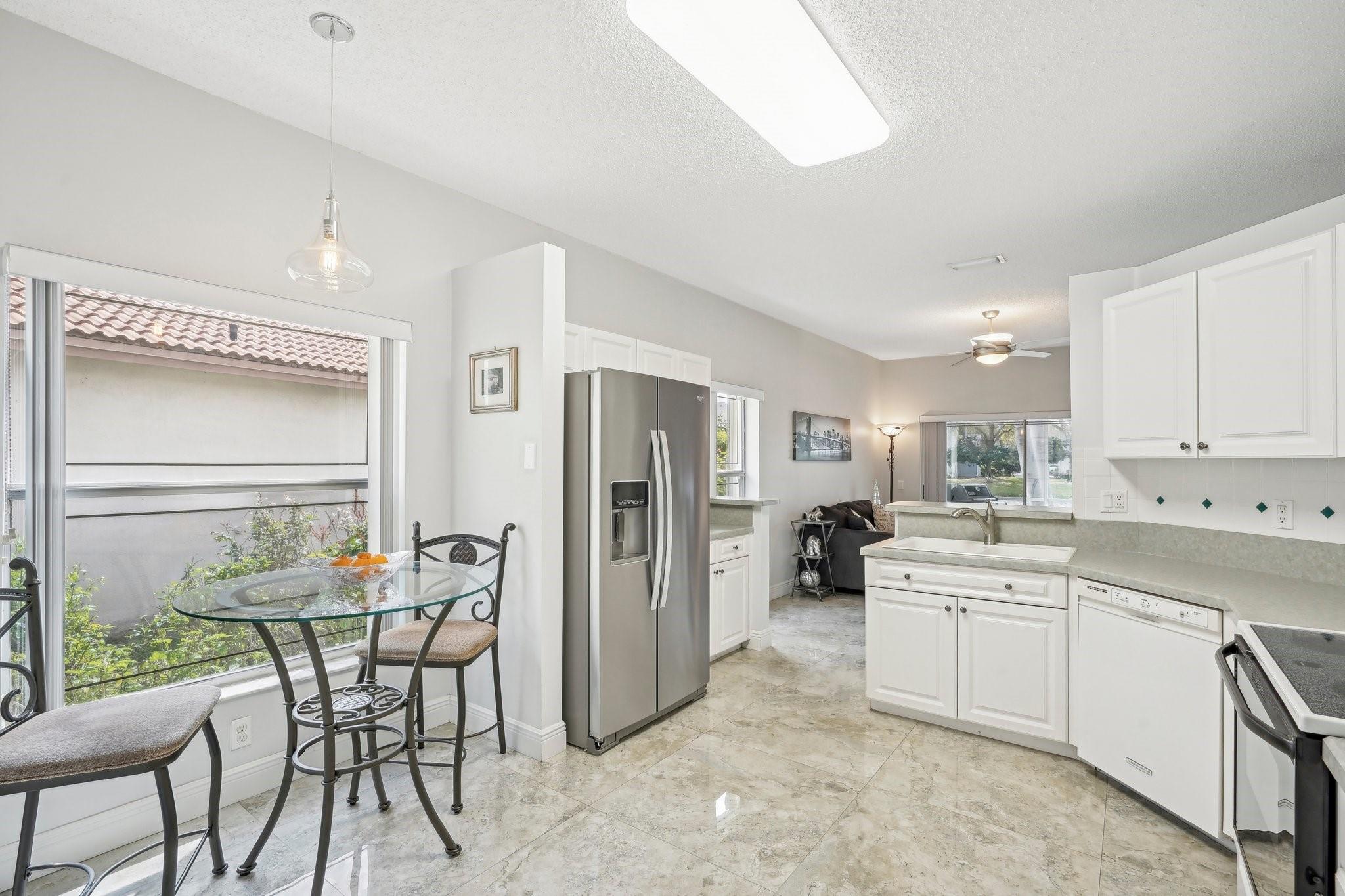 Open and bright kitchen with dining area