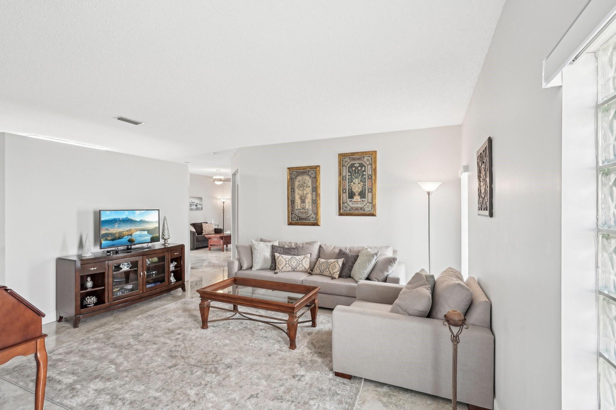 Enter into an inviting and very bright living room