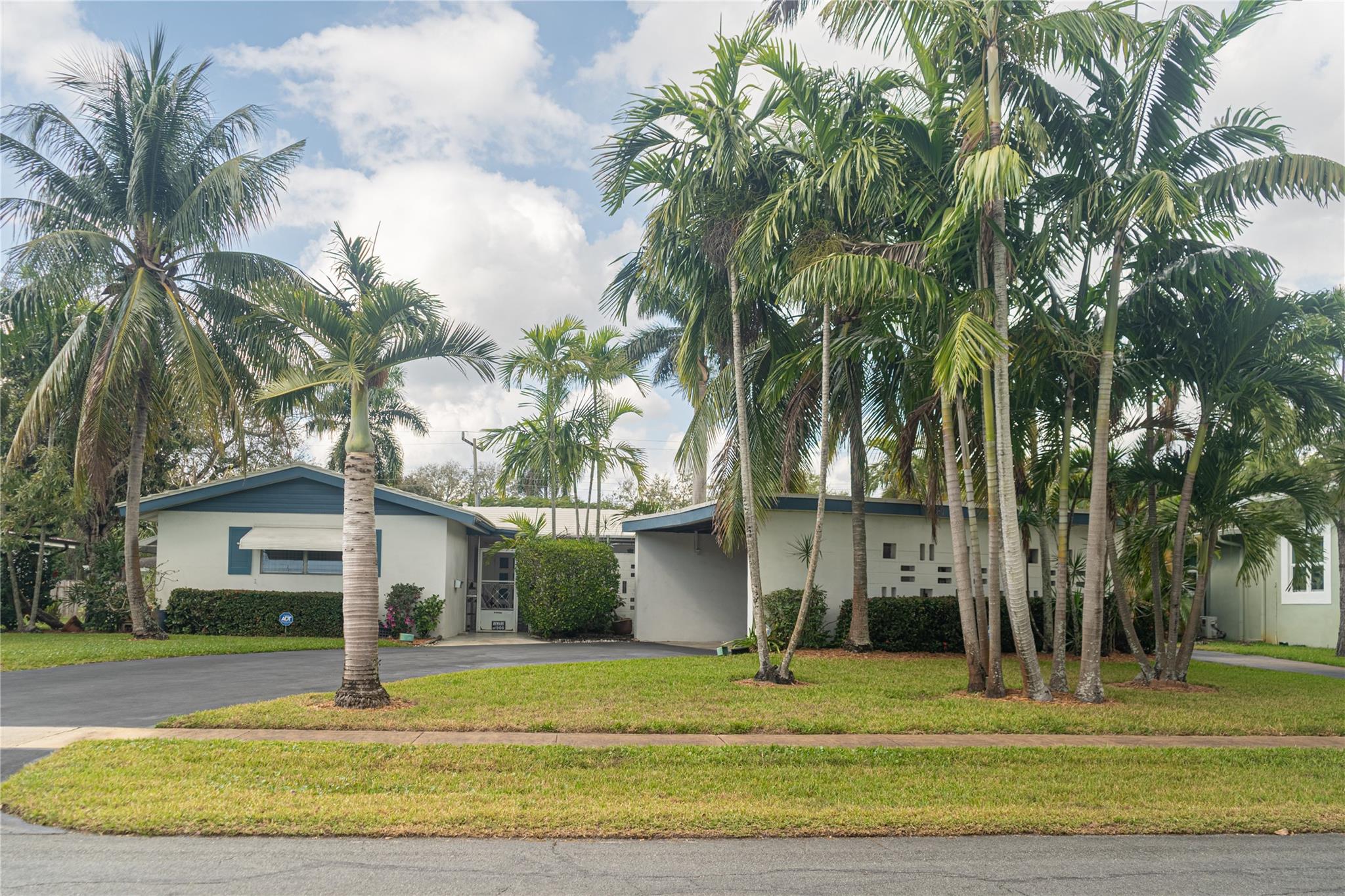 Lush landscaping with circular driveway