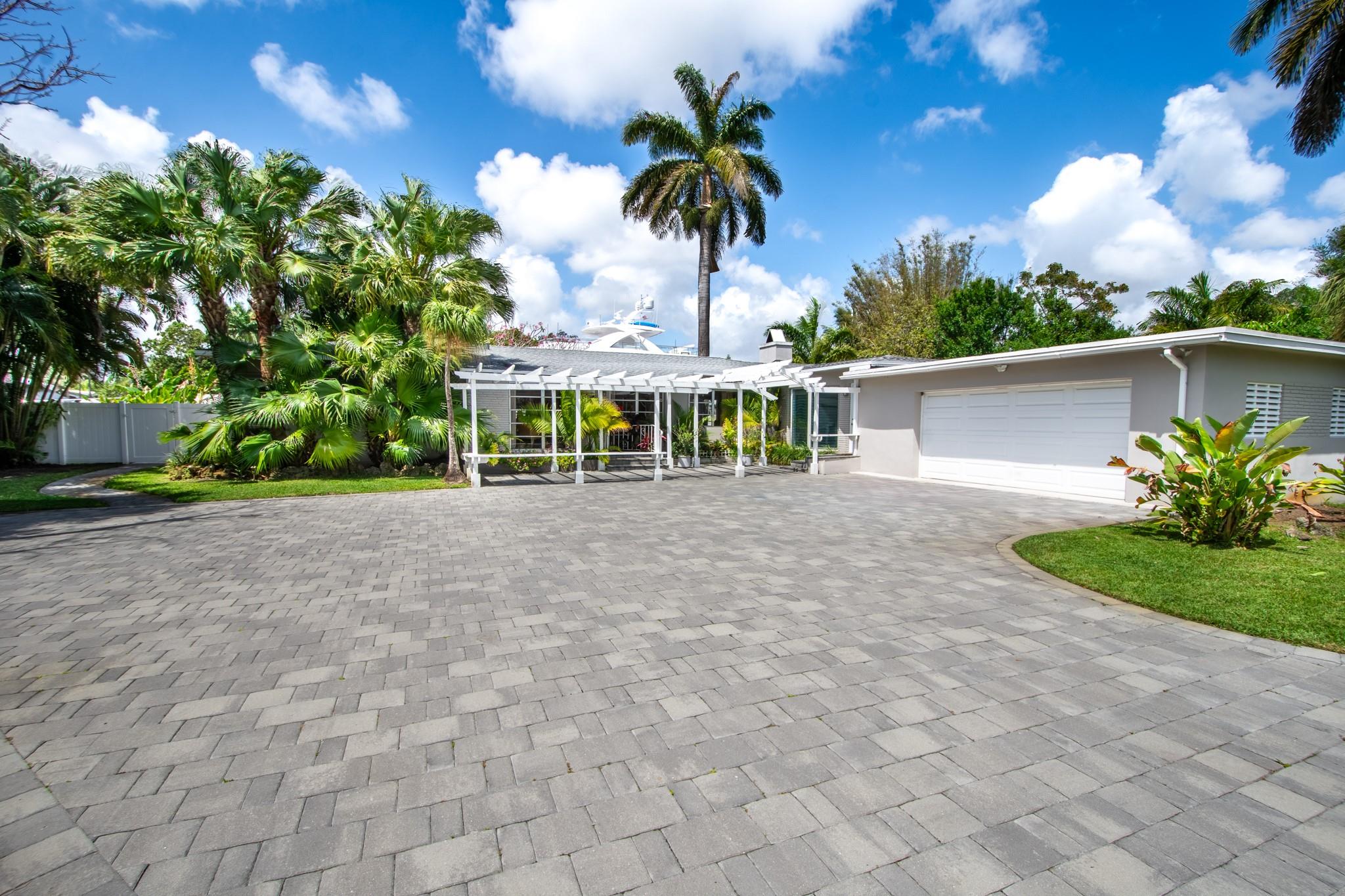 clean fresh exterior with paver driveway