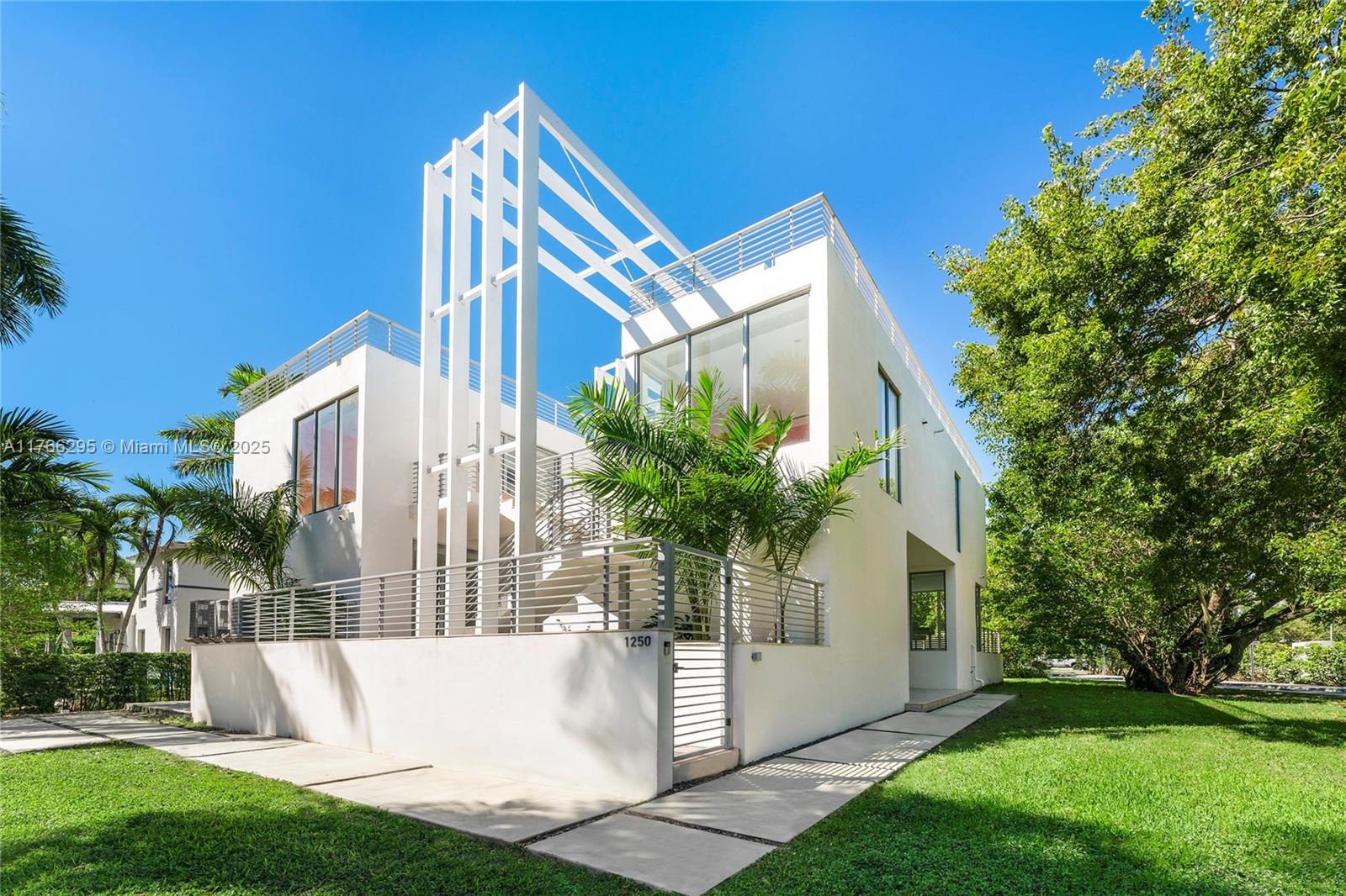 This visually captivating, modern tri-level home, sits on a 7,500 SF corner lot offering 5,016 SF & a spacious rooftop lounge made to entertain with a lap pool - an oasis to enjoy sunsets over the Miami skyline & bay. Never lived in, the 7 BR/ 7.5 BA home features fine stone floors, & large windows provide a seamless indoor-outdoor experience. Ground floor boasts a spacious living room w/access to an expansive terrace, sleek chef’s kitchen & adjacent dining space. 3 bedrooms on this level.  2nd floor offers 4 additional BRs all with walk-in closets & ensuite bathrooms. The principal suite features a private terrace & beautiful spa-style bathroom. Ideal location – minutes to beaches, fine dining/shops, downtown, top schools & MIA. This home embodies the Venetian Island’s luxury lifestyle.