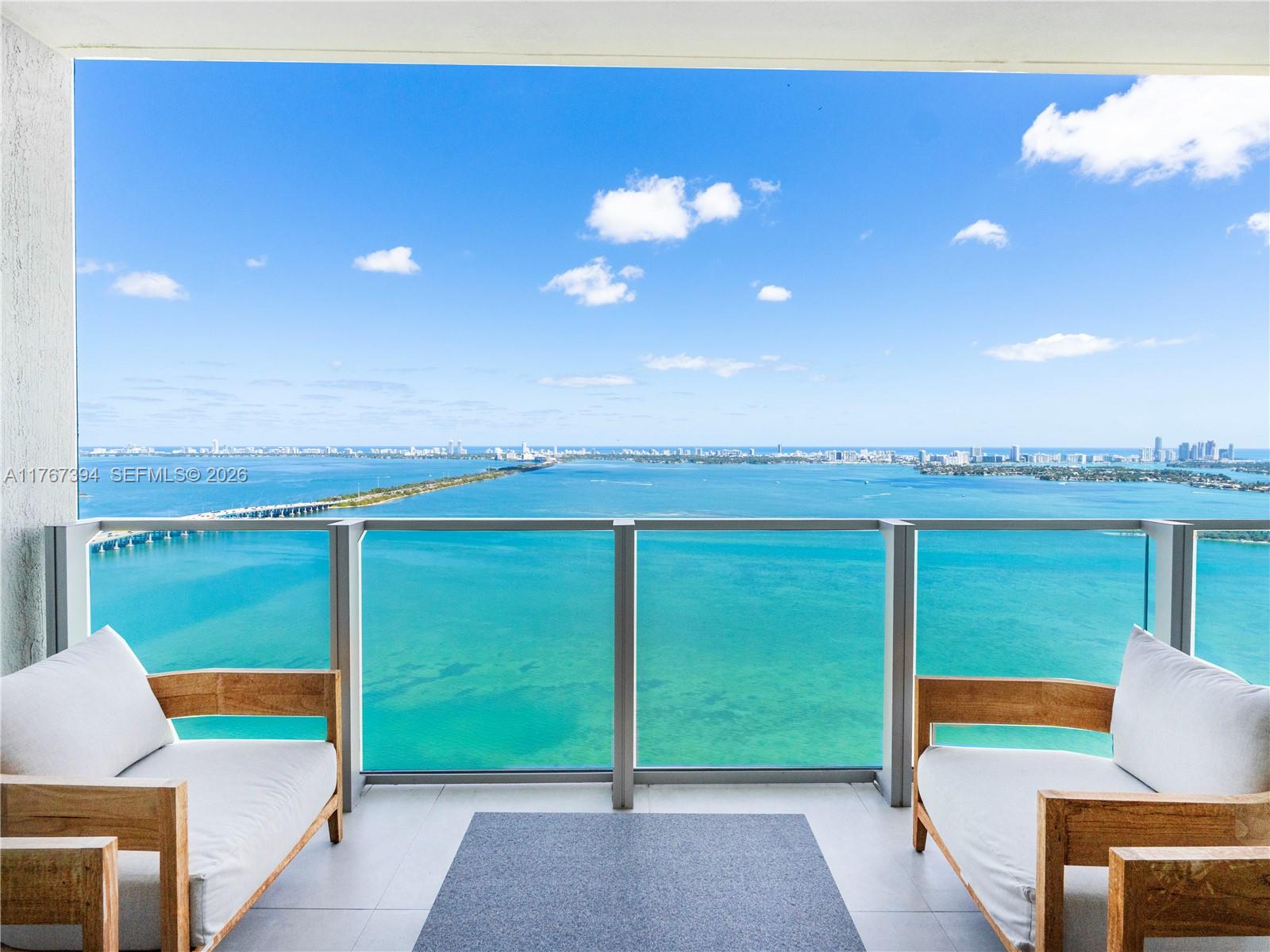 Fully Furnished 2-bed, 2.5-bath condo at Biscayne Beach in the heart of Edgewater.  Beautifully designed with elegant wallpaper throughout,  with designer furniture and finishes. Enjoy breathtaking direct Bay views from your spacious balcony with access from living space and primary bedroom. Features include custom cabinetry in each walk-in closet and bar area, a private elevator foyer entrance, and 2 assigned parking spaces. Biscayne Beach offers resort-style amenities including, two pool decks, resident BBQs, tennis courts, beach volleyball and entertainment area, gorgeous spa, fitness center, and more. Conveniently located near Design District, Wynwood, Miami Beach, and Brickell.