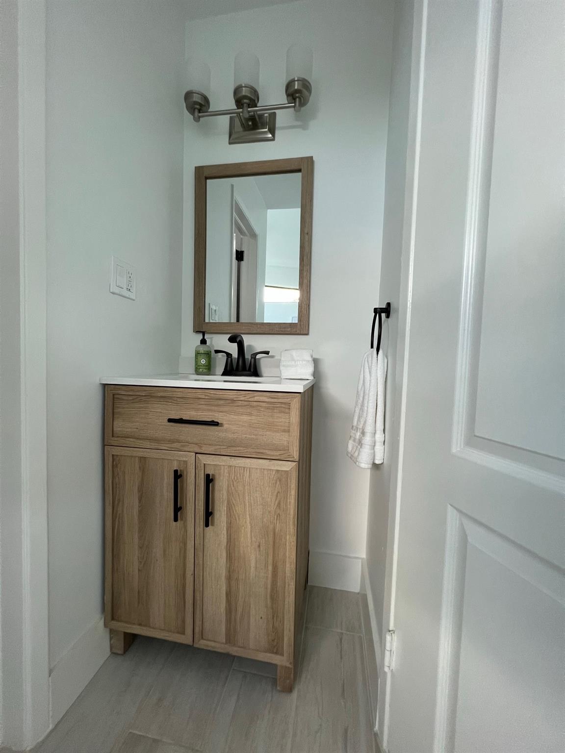 Guest Bedroom with private back yard view, 
Fantastic Transom windows add style and natural light, ALL Bedrooms are en-suite w/ Full Baths