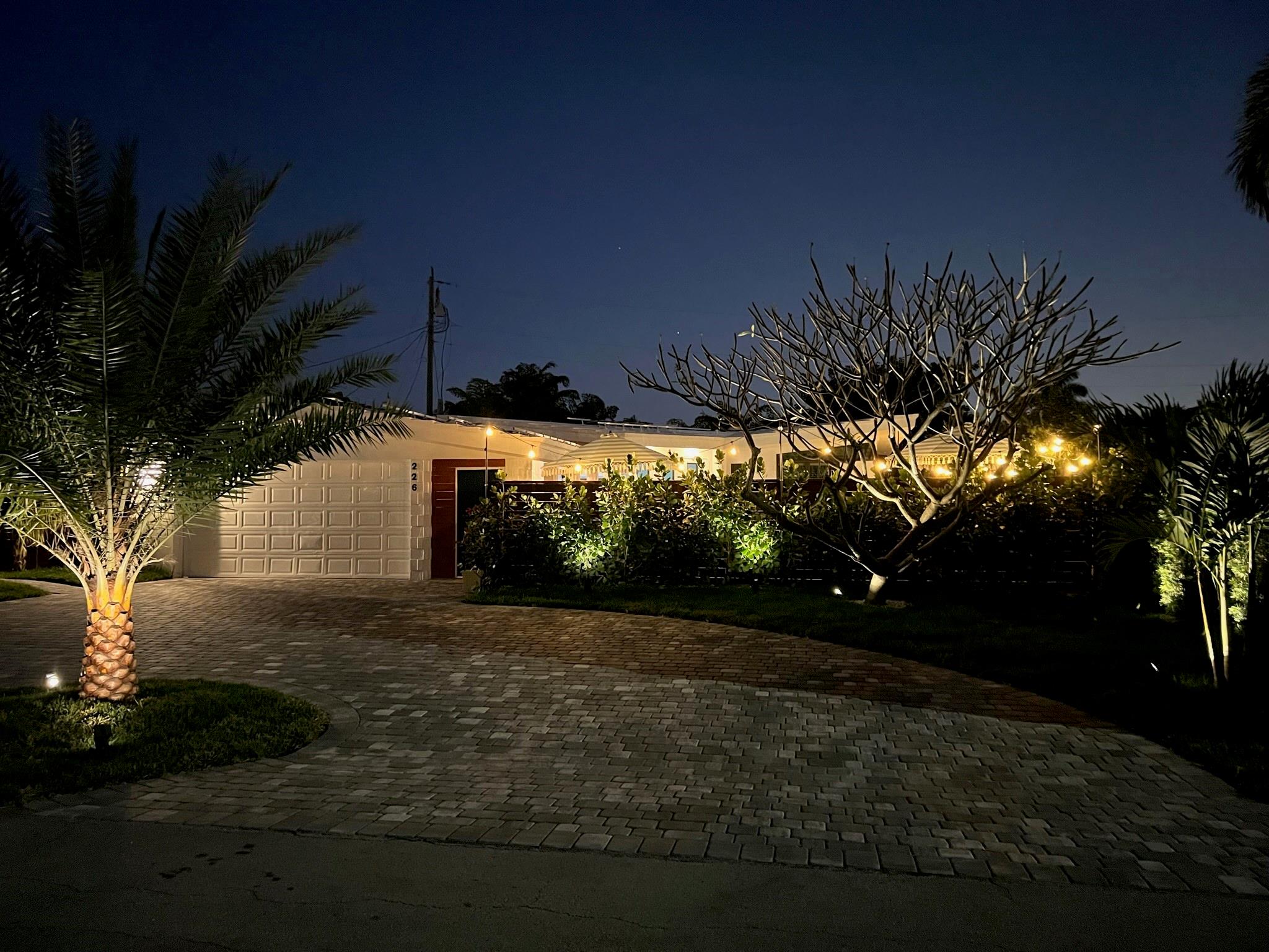 Dramatic Tropical Curb Appeal hints at the beautiful home inside the Courtyard Entrance