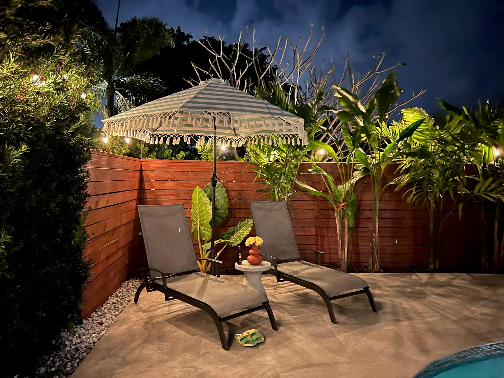 Cozy COurtyard Seating area with Sparkling Pool View