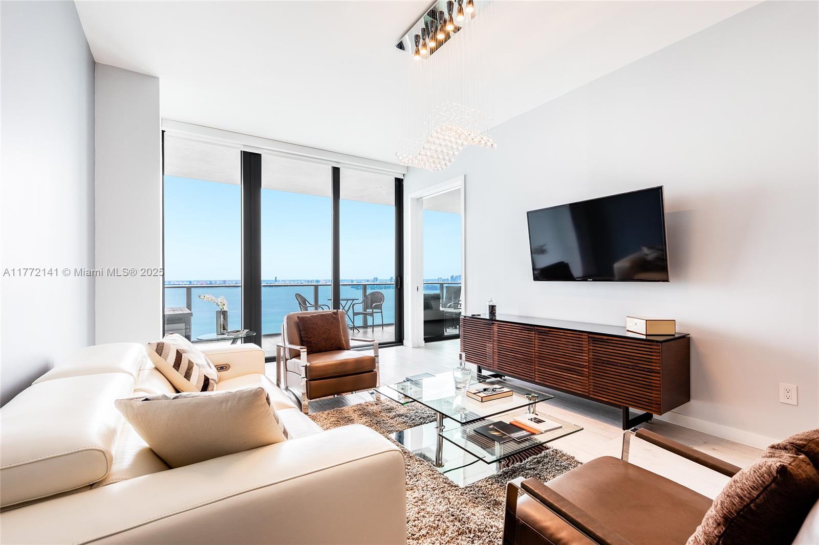 Tenant occupied through November 30, 2026. Impressive unit with 2BR + Den & 3 full BAs at Gran Paraiso offering endless views to the bay and the ocean. Entertain guests in a luxurious island kitchen with integrated Subzero refrigerator/freezer, stone countertops & Italian cabinets. Additional highlights include private elevator w/ direct access to the unit, custom built-ins, porcelain tile floors throughout & large terrace. The unit is facing east so you will wake up to a beautiful sunrise every day! Enjoy the Miami lifestyle w/great amenities starting with the Amara restaurant, private beach club w/ poolside cabanas, heated pools, tennis cts, lounges, library, children's playroom, wine room, state-of-the-art fitness center, outdoor spa, sun terrace, outdoor yoga & more.