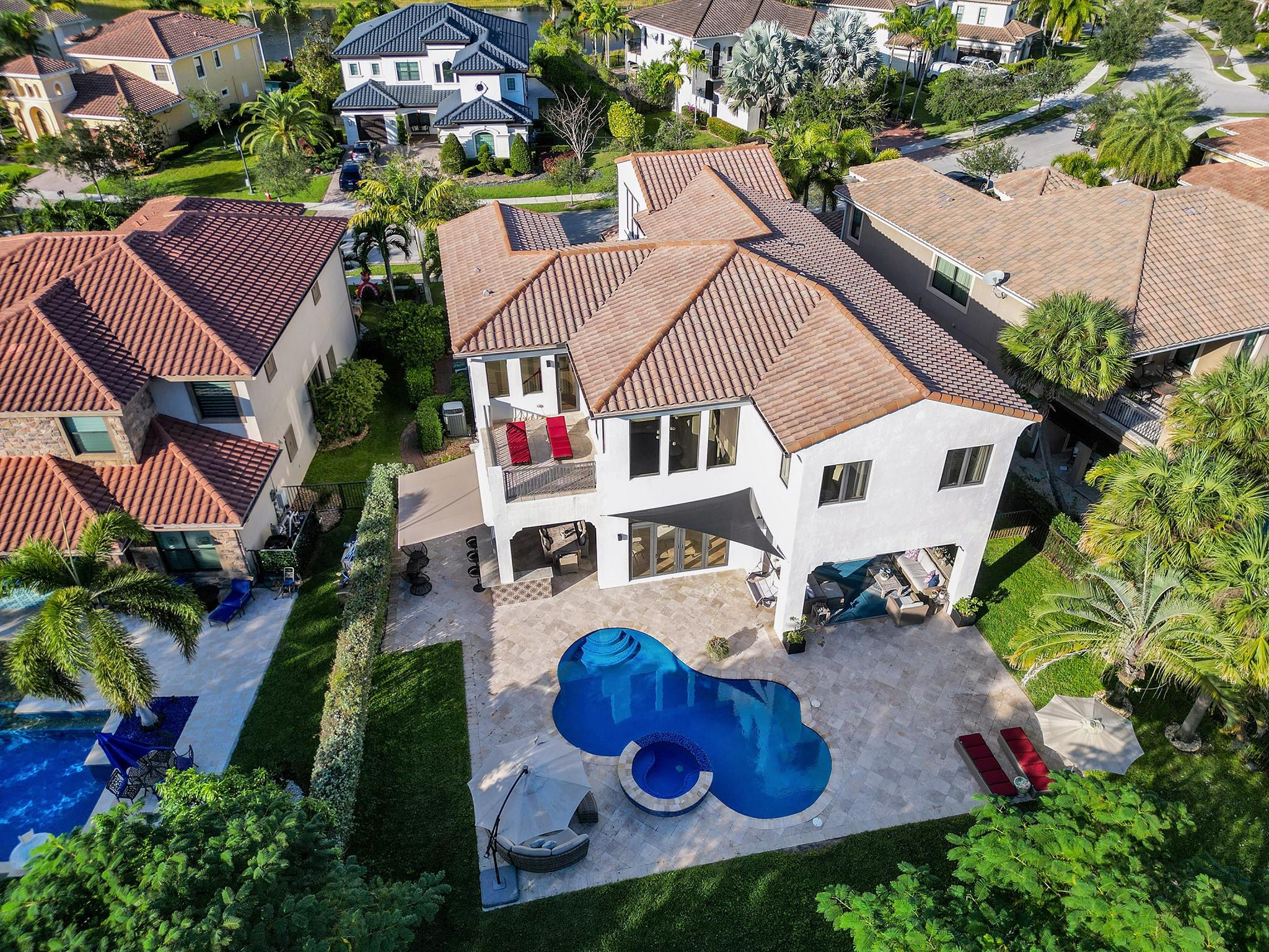 With expansive windows, glass doors, and a terrace, everything is oriented toward the golf course.