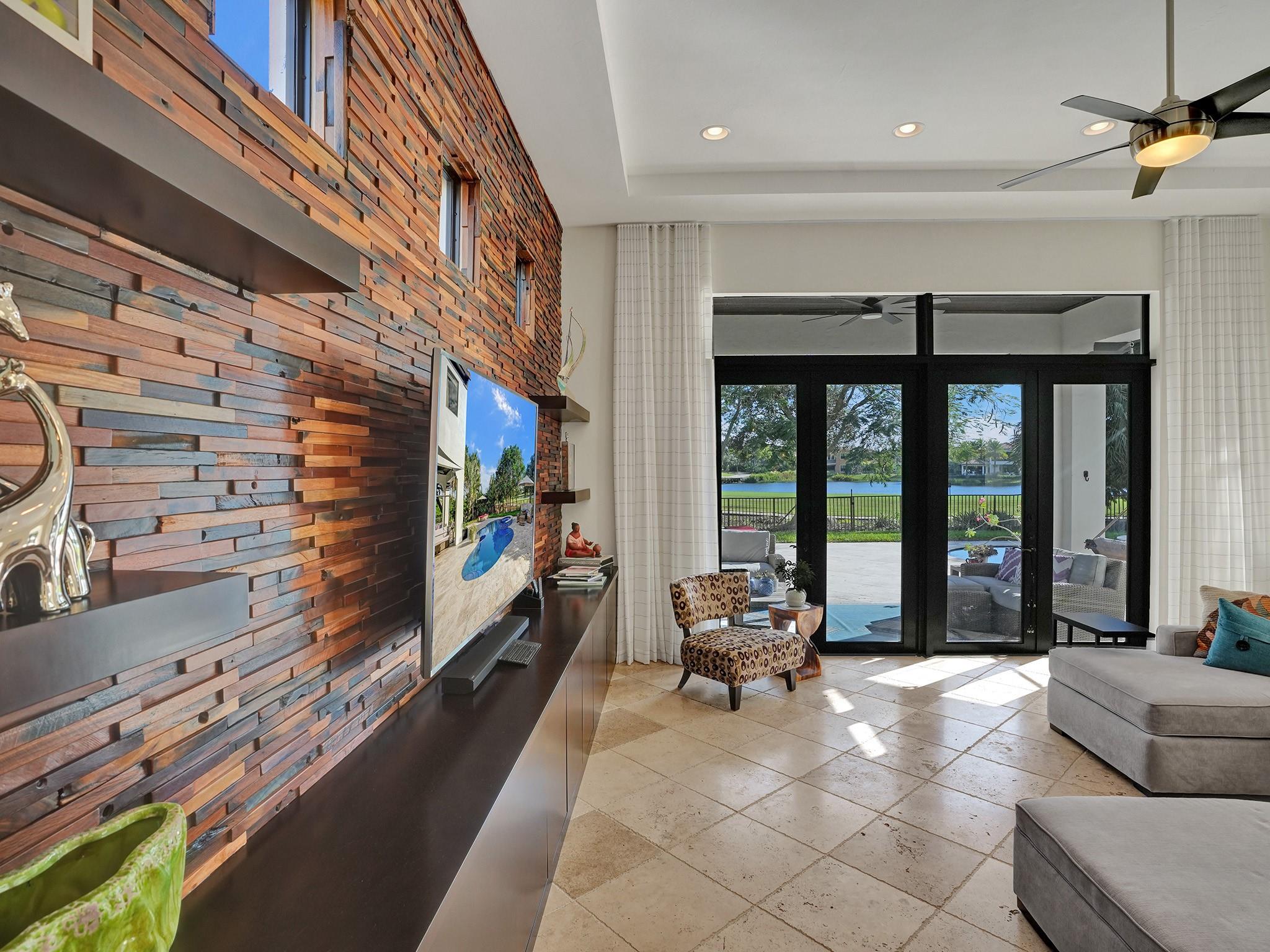 Take a closer look at the intricate details on the wall and the stunning view in the yard. The built-in cabinets provide ample storage, allowing for a well-organized and tidy space.