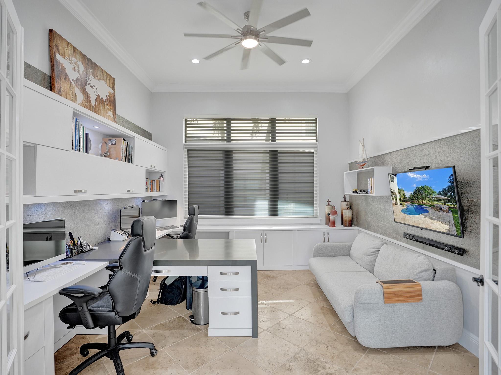 French doors open to the room, creating your own space. Side-by-side built-in offices with lots of cabinets for a well-organized area.