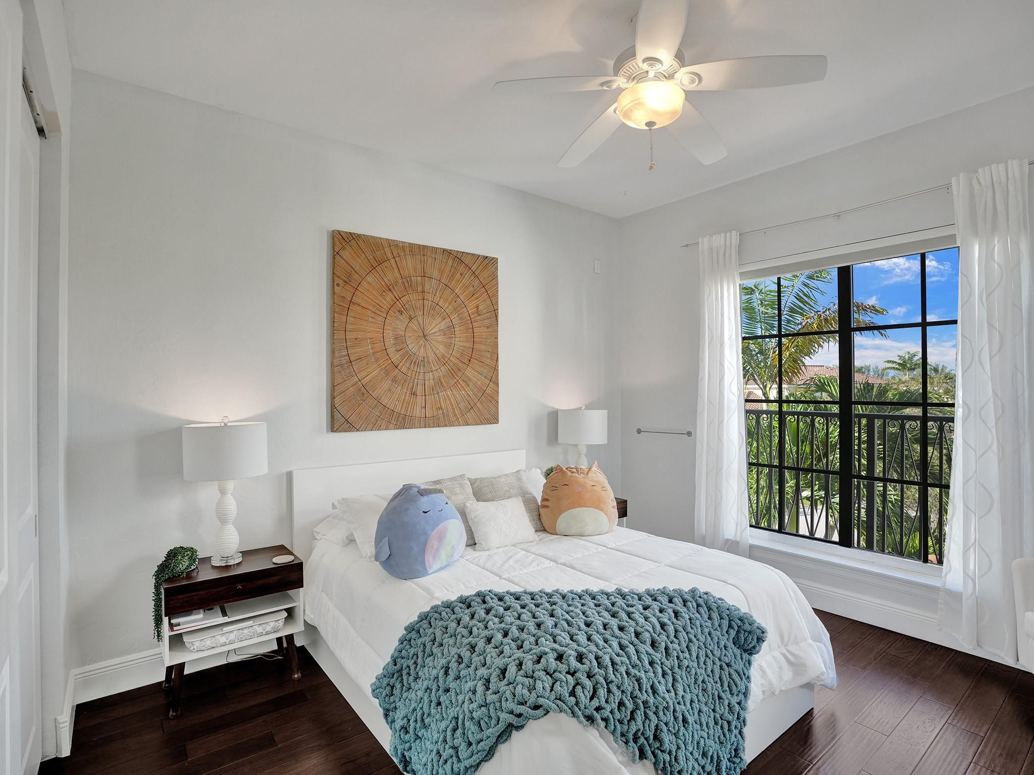 Bedroom is bright with two balconies and a charming nook for makeup or personal use.