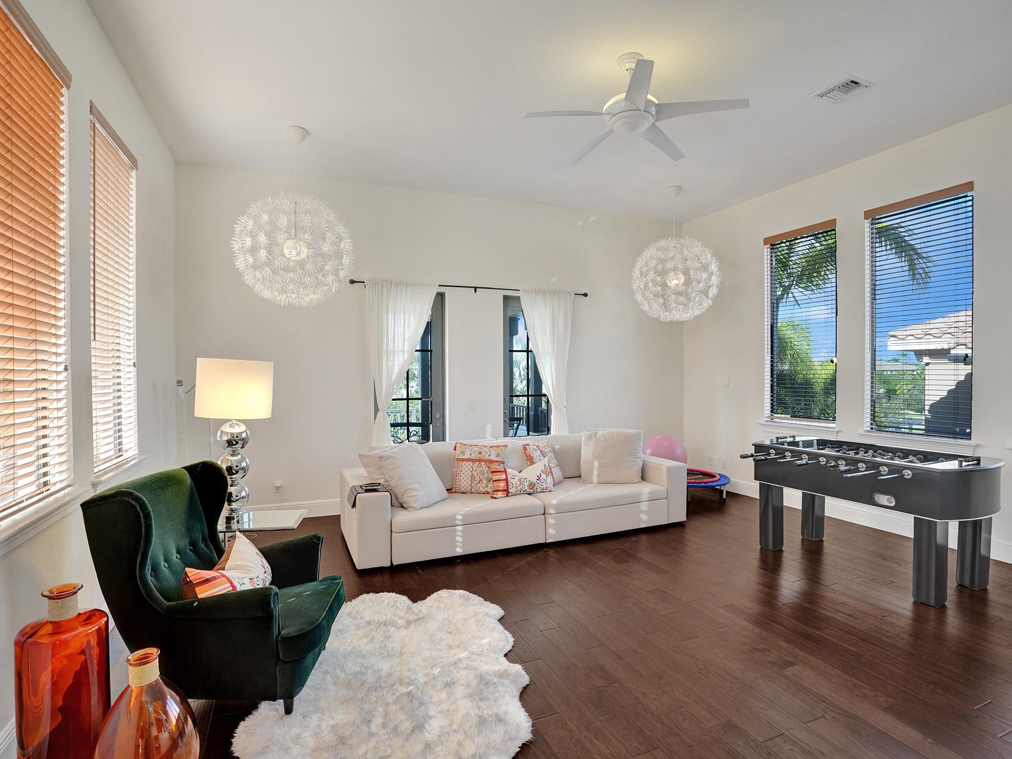 Bright 5th bedroom/game room/media room with its own balcony.