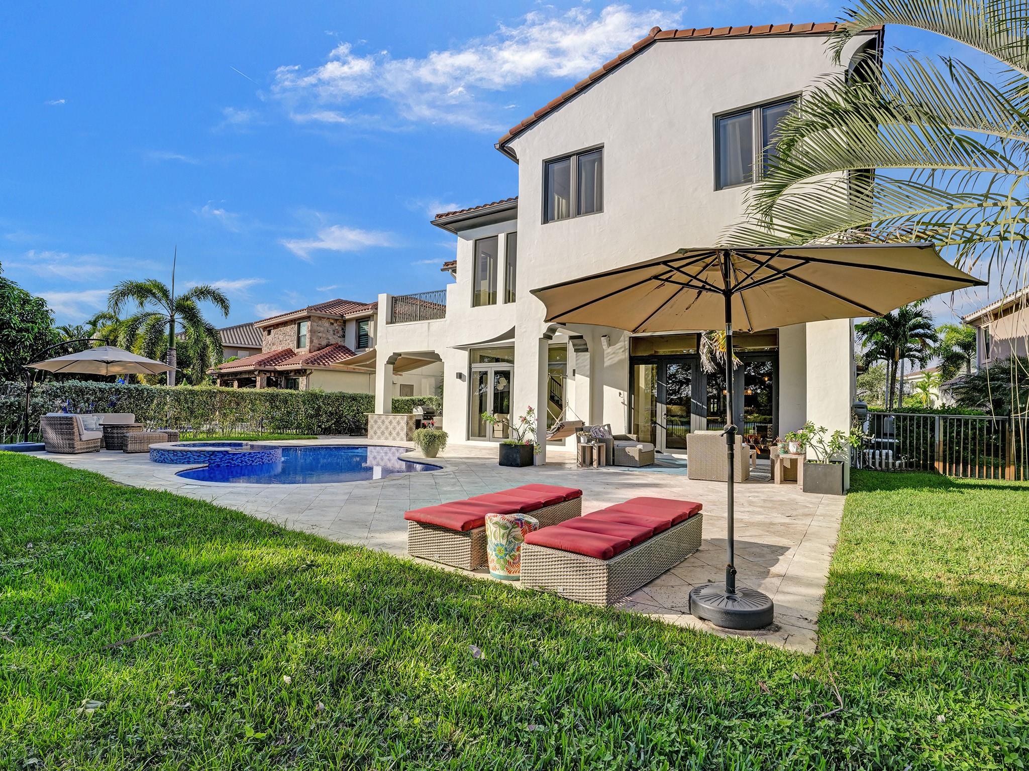 Beside the expansive terrace for entertaining, there's also plenty of open grass area for additional outdoor enjoyment.