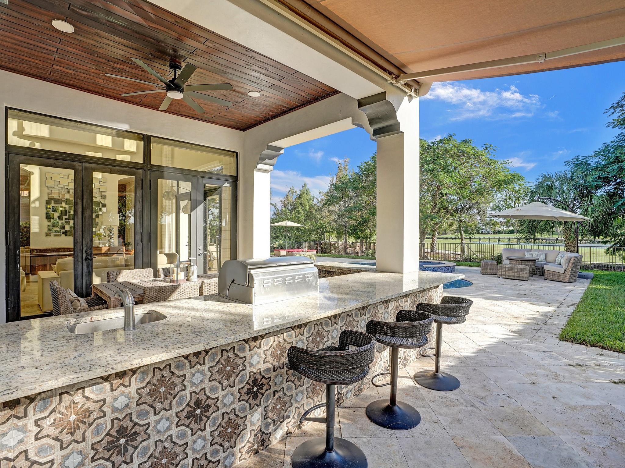 Savor the bar and the view in the shade with the added overhead covering.