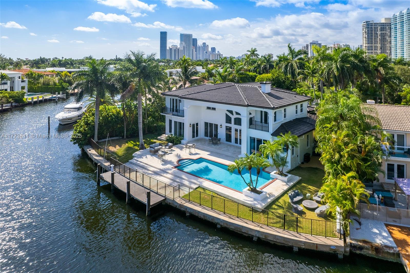 Welcome to a remarkable estate in exclusive Golden Beach—the best-priced waterfront property available! Nestled on a serene cul-de-sac with 125 ft of tranquil waterfront, this turnkey Mediterranean masterpiece at 455 Center shines. Beyond the private gate, vibrant landscaping unveils a bright, sophisticated home featuring lofty ceilings and a seamless floor plan. Six generous bedrooms—each boasting stunning water views—and 6.5 exquisite bathrooms include a sprawling and oversized first-floor master retreat radiating luxury. Intelligently designed spaces flow effortlessly, offering an ideal layout. Situated on prestigious Center Island, just steps from the private beach, parks, and tennis courts, this home offers unbeatable value.