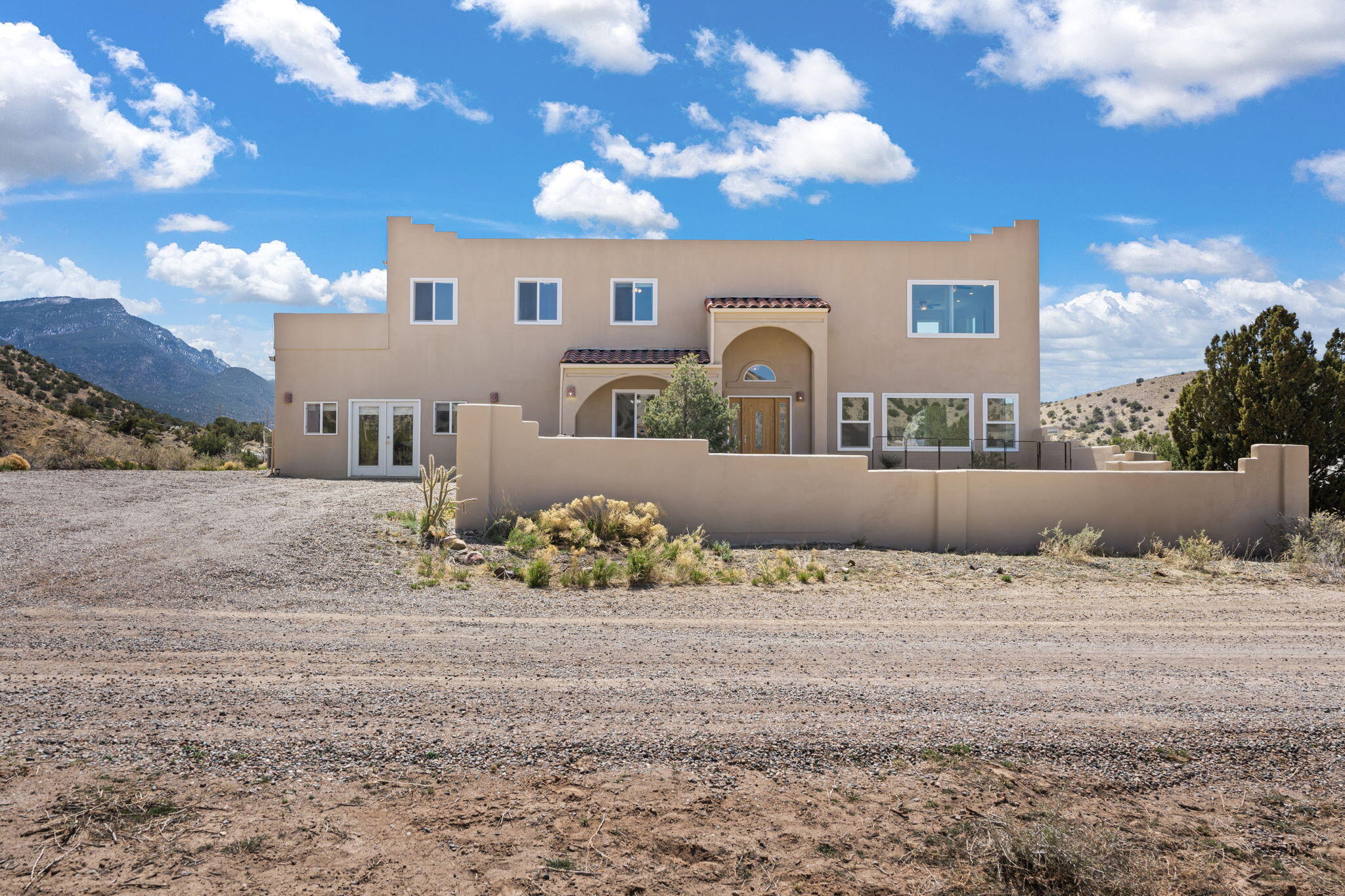 Looking for AirBnB potential? Picture this. Breathtaking mountain views surround this spectacular Placitas home conveniently located with a short journey to either Albuquerque or Santa Fe! Enjoy panoramic vistas of the Sandia & Jemez Mountains and stunning Cabazon sunsets through large, sunny picture windows. This beautifully remodeled home features two versatile bonus rooms--ideal for a den, studio, office, or hobby space. Relax on the expansive deck overlooking Sandia Peak, petroglyphs, and roaming wild horses. A spacious climate controlled workshop offers potential for added living space or easy garage conversion. Southwest living at its finest! Come see it today.