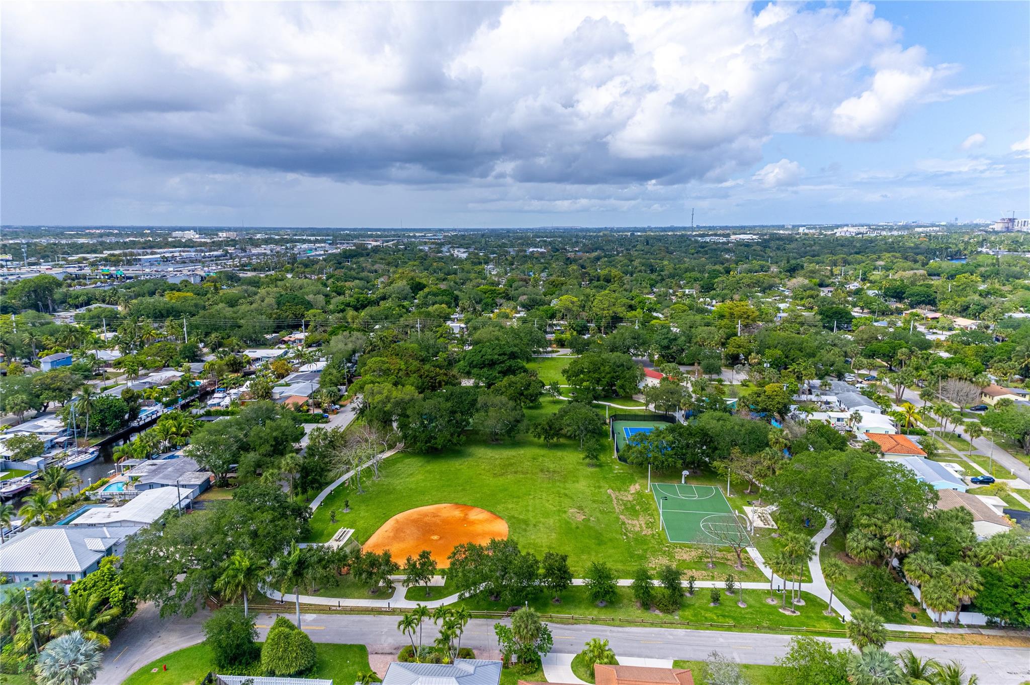 5+ acres of greenspace one street over with volleyball, tennis, walking paths, playground, workout stations