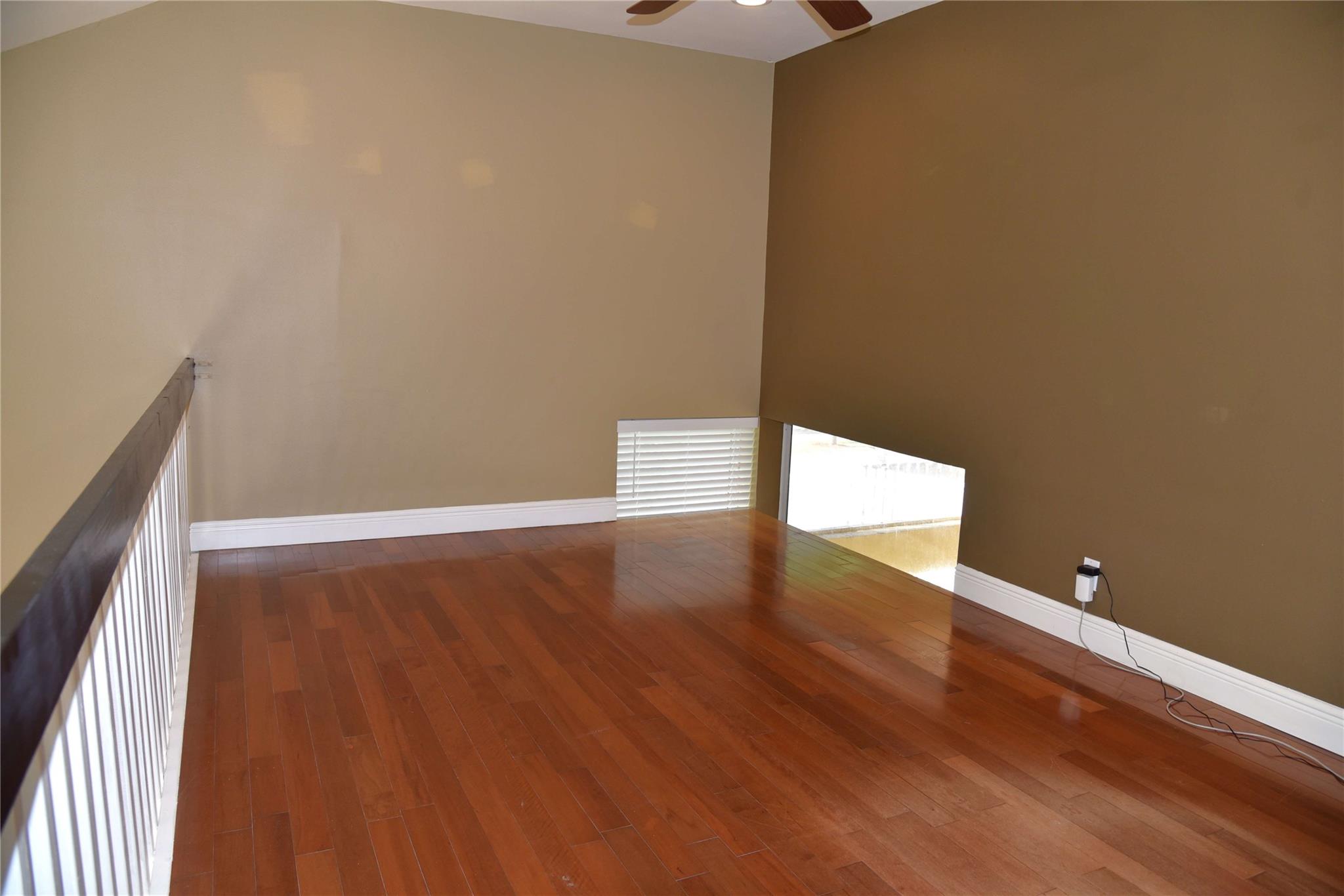 Large Loft upstairs- could be fourth bedroom or office/ hardwood flooring