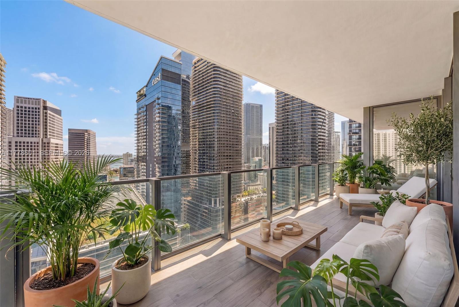 Indulge in this exquisitely reimagined 2/2.5 residence at The Rise Brickell City Centre that offers sweeping sunrise views over Biscayne Bay & the Miami skyline with floor-to-ceiling windows & a generous wraparound balcony. Every detail has been curated to perfection—from the grand 48x48 Gubi porcelain tile flooring to the sleek, modern kitchen with bespoke Italian cabinetry, honed marble countertops, Bosch appliances. The spa-inspired primary bathroom is a masterpiece in design, featuring a freestanding soaking tub & luxurious 120x120 Eco Ceramics wall tiles. Immerse yourself in a lifestyle of indulgence with exclusive access to 5-star amenities: a fitness center, heated pool, valet, Hammam spa, steam room, & more—just steps from the world-class shopping & dining of Brickell City Centre.