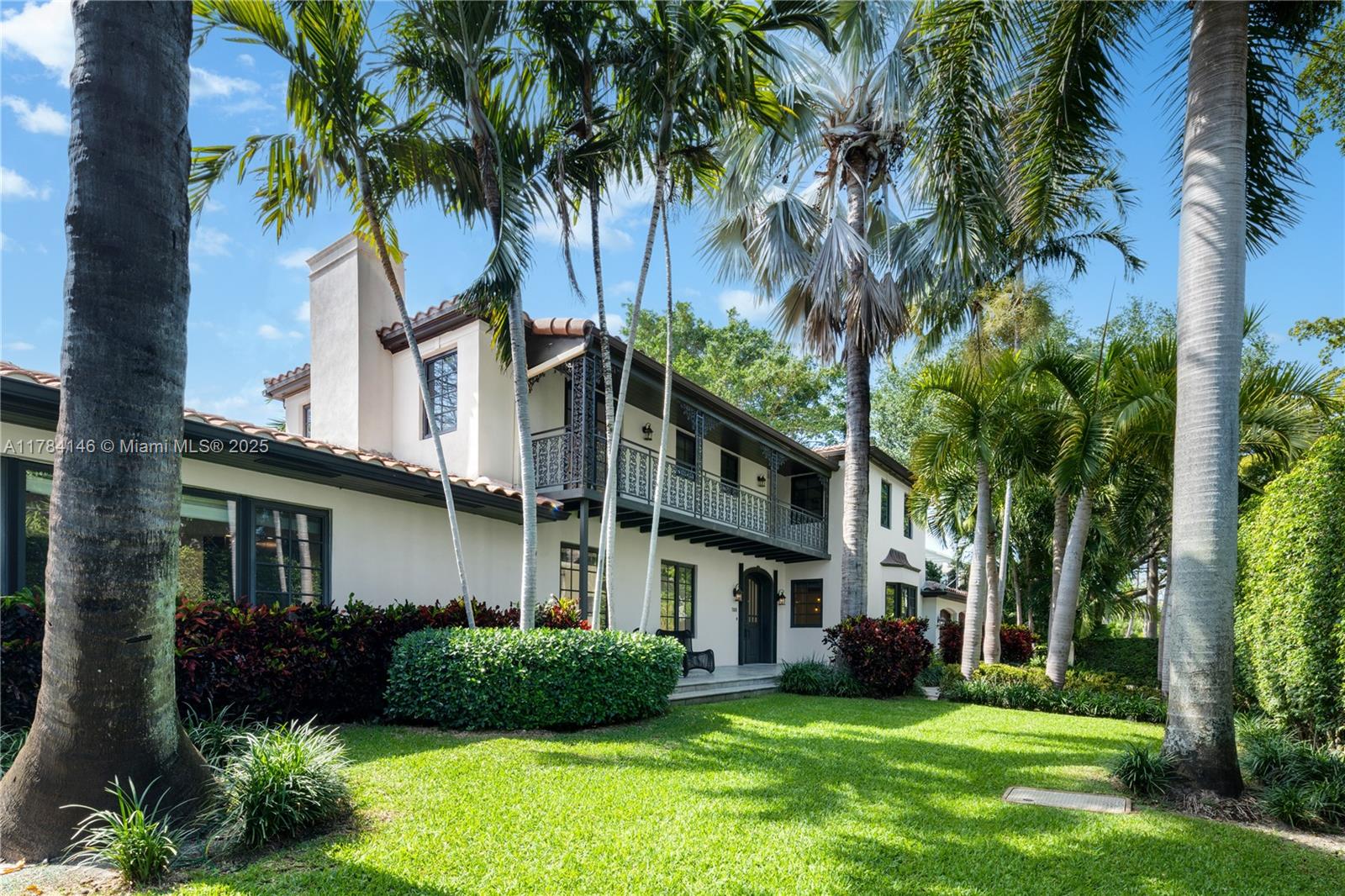 Timeless elegance meets modern comfort in this beautiful 4-bedroom, 4.5-bath two-story residence located on a corner lot in Miami’s exclusive Venetian Islands. Gated and surrounded by lush landscaping, this home offers privacy and charm with classic Mediterranean architecture. Inside, enjoy a light-filled living area, formal dining room, and chef’s kitchen with black stone counters and custom cabinetry. French doors open to a tropical backyard retreat with a sleek lap pool and lounge area—perfect for entertaining. Upstairs, the spacious primary suite features hardwood floors and garden views. A two-car garage and generous driveway provide ample parking. Minutes from Sunset Harbour, the Design District, and the beach.