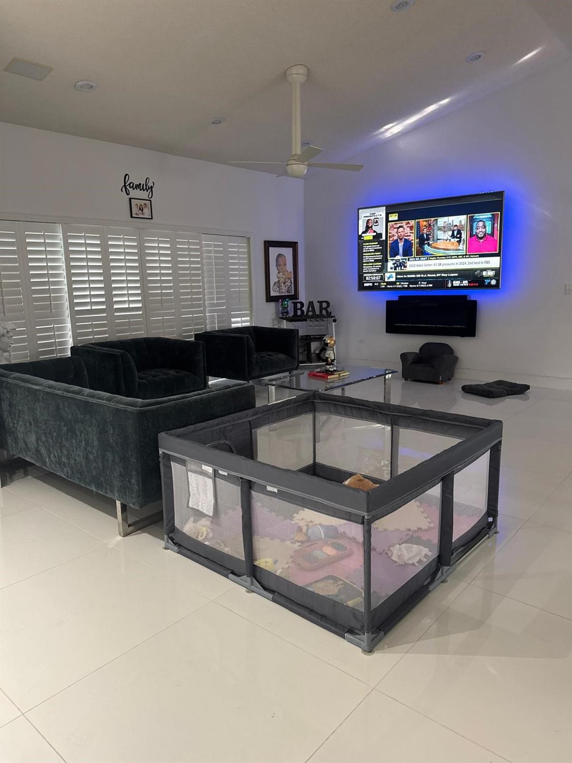 Living room, new floors, 80 inch TV