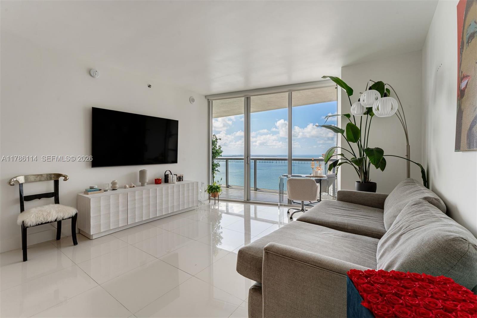 A beautifully furnished 1 Bed, 1 Bath condo w/over 1,000 interior sq ft, white porcelain tiled floors in living areas, marble floors in the bathroom, motorized shades, a large walk-in closet, kitchen appliances by Wolf & Sub-Zero, 10-foot-high ceilings w/flloor-to-ceiling glass windows, and breathtaking views of Biscayne Bay & city skyline from the 35th floor. The largest one-bedroom floor plan at Icon Brickell. Includes 1 assigned parking space. Monthly condo dues cover basic cable TV, high-speed internet, & water. Building amenities include a 300-foot-long swimming pool, 50-person hot tub, movie theater, a 28,000-square-foot spa & fitness center, full-service concierge, on-site restaurants, & more. Within blocks of the shops & restaurants at Brickell City Centre & Mary Brickell Village.