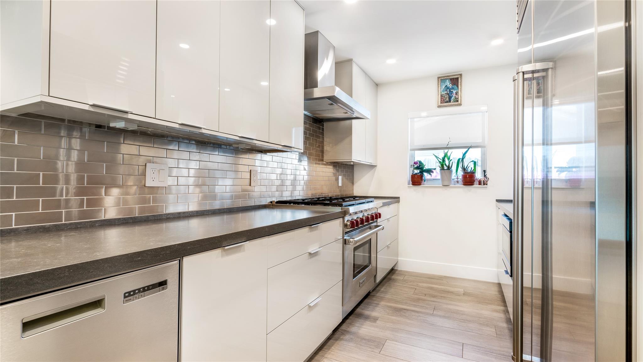 Gourmet kitchen with Wolf, Sub Zero + Franke appliances