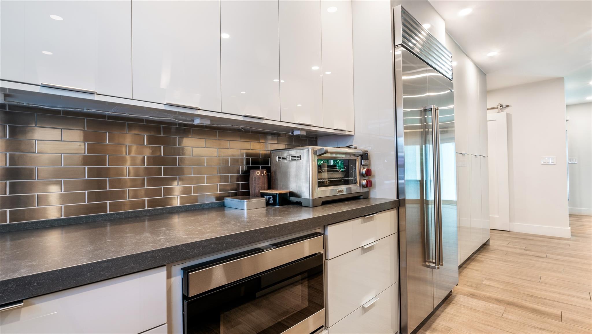 Gourmet kitchen with Wolf, Sub Zero + Franke appliances