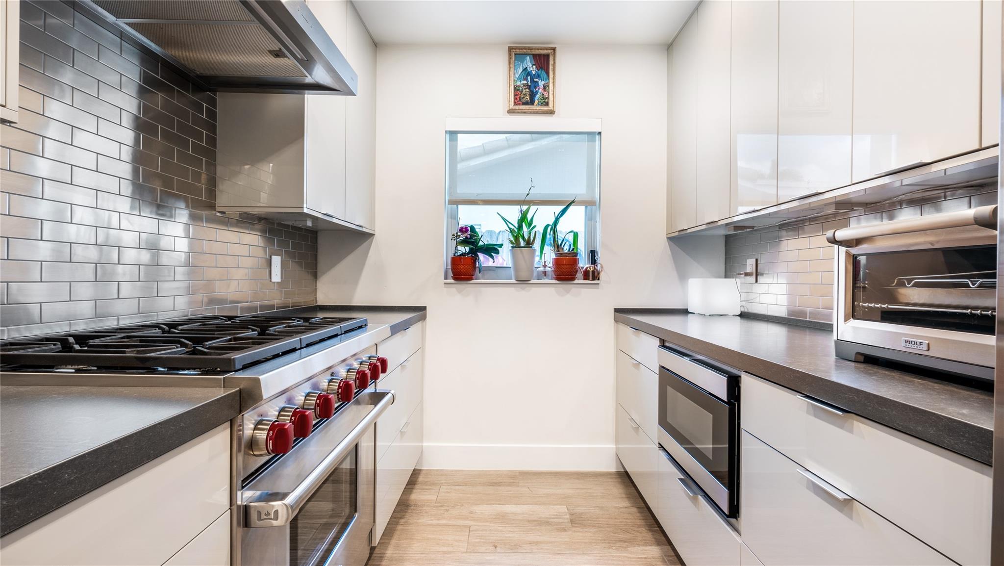 Gourmet kitchen with Wolf, Sub Zero + Franke appliances