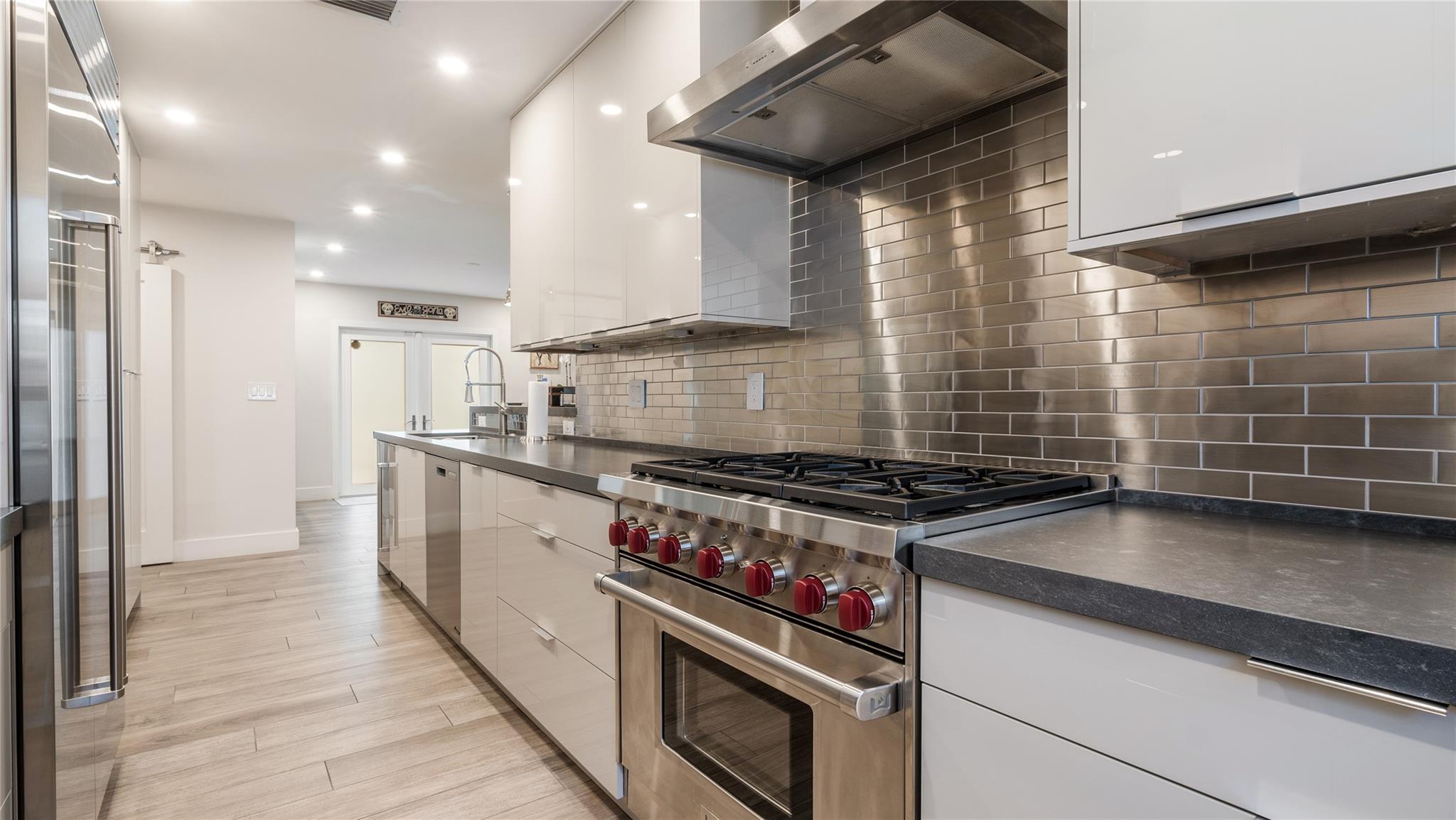 Gourmet kitchen with Wolf, Sub Zero + Franke appliances