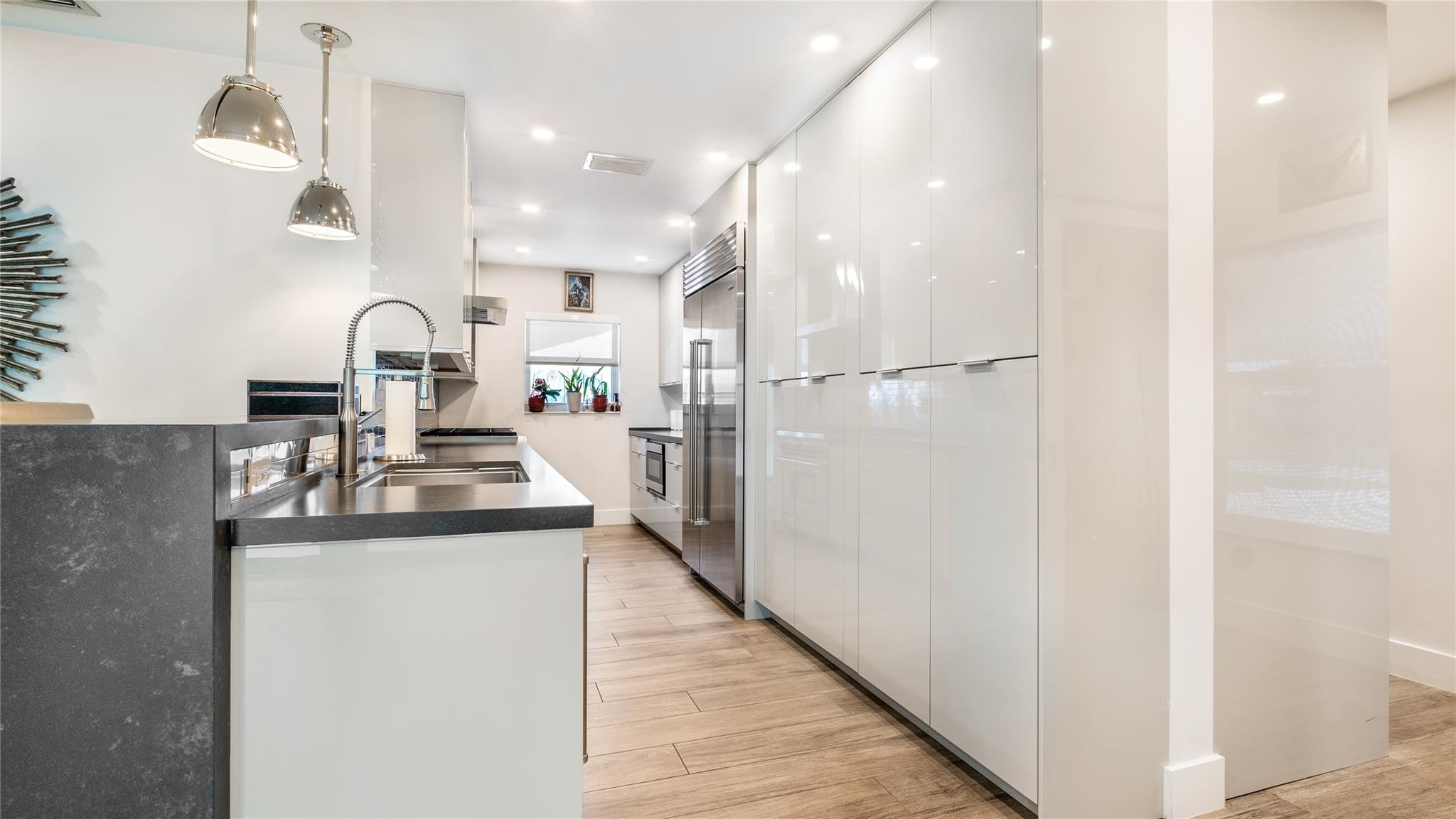 Gourmet kitchen with Wolf, Sub Zero + Franke appliances