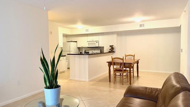 Move-in ready...Bring an Offer - Condo is in excellent condition with split floor plan & two convenient parking spaces (#200 & #234). Upgraded features include NEW - A/C, Hot Water Heater, Oven, Microwave, Washer/Dryer, Fans, Window Treatments, Carpet, Paneled Doors and Custom Paint. Bathrooms have NEW shower, tile in tub, toilets, mirrors & flooring. There is an ADT Security System & full Accordion Shutters. Lighthouse Cove is a well-maintained community with recent upgrades including new roofs, painted exteriors & repaved parking lot. Resort-style amenities include - heated pool, fitness center, indoor racquetball, tennis, pickleball, billiards, grills & clubhouse. You can rent immediately upon ownership.