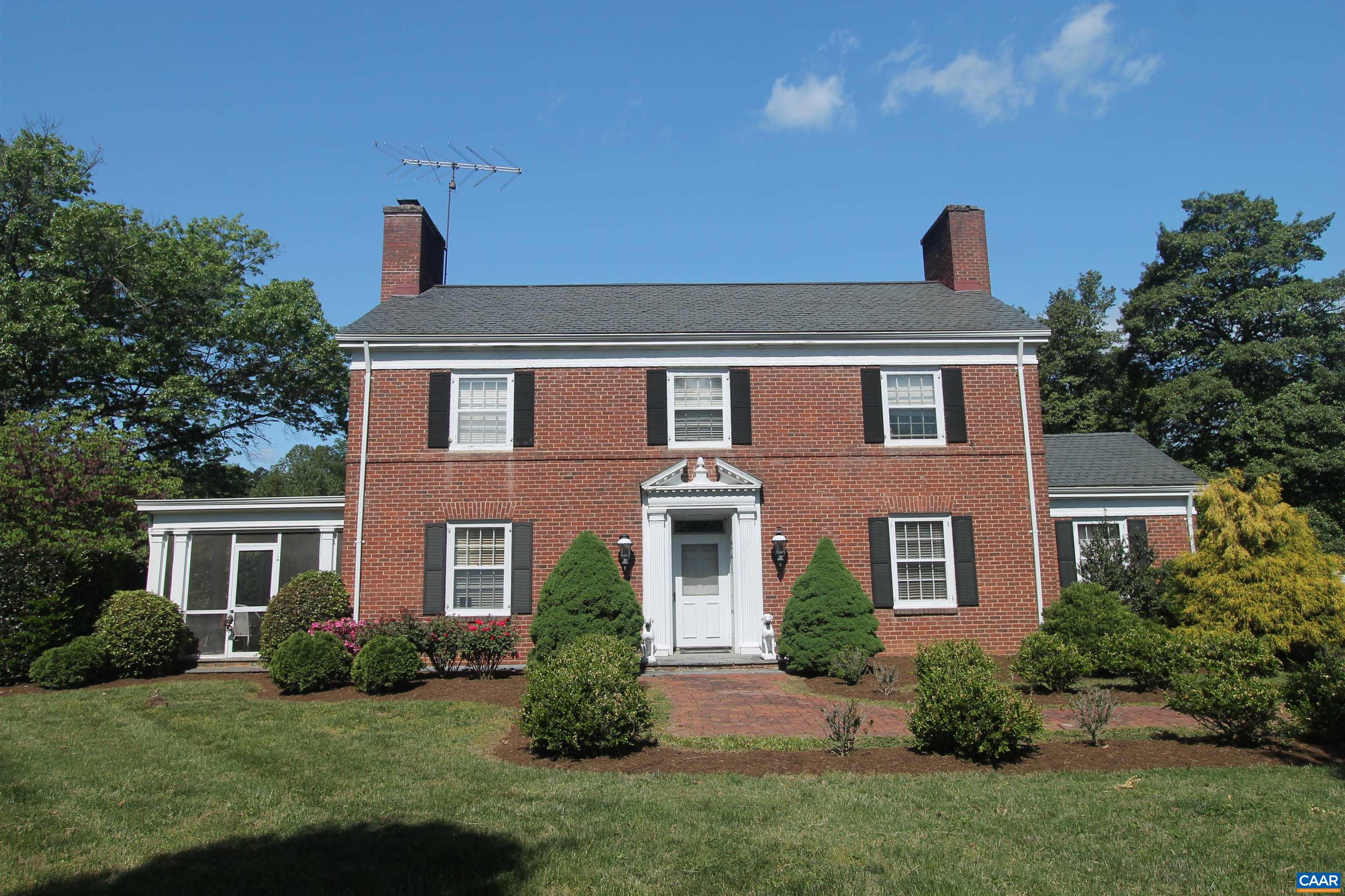 Out of Bounds is a stately brick residence that offers an exceptional blend of location, privacy, and timeless character. Nestled on beautifully landscaped grounds, this classic two-story Virginia home was built in 1940 and features nearly 3,000 finished square feet of refined living space.  The gracious interior showcases high ceilings, generously proportioned rooms, 4 Fireplaces, and extensive custom wood trim throughout. With stunning views of the manicured grounds, the home offers both elegance and comfort, making it ideal for entertaining or everyday living.  Additional highlights include a charming screened-in porch,  2 Heating Sources (Heat Pump and Boiler), a detached garage with a carport, and mature gardens accented by brick and stone walkways. The property offers remarkable privacy while enjoying the convenience of an in-town location. This is a rare and wonderful offering—an ideal opportunity to own a distinctive home in one of the area’s most desirable locations.