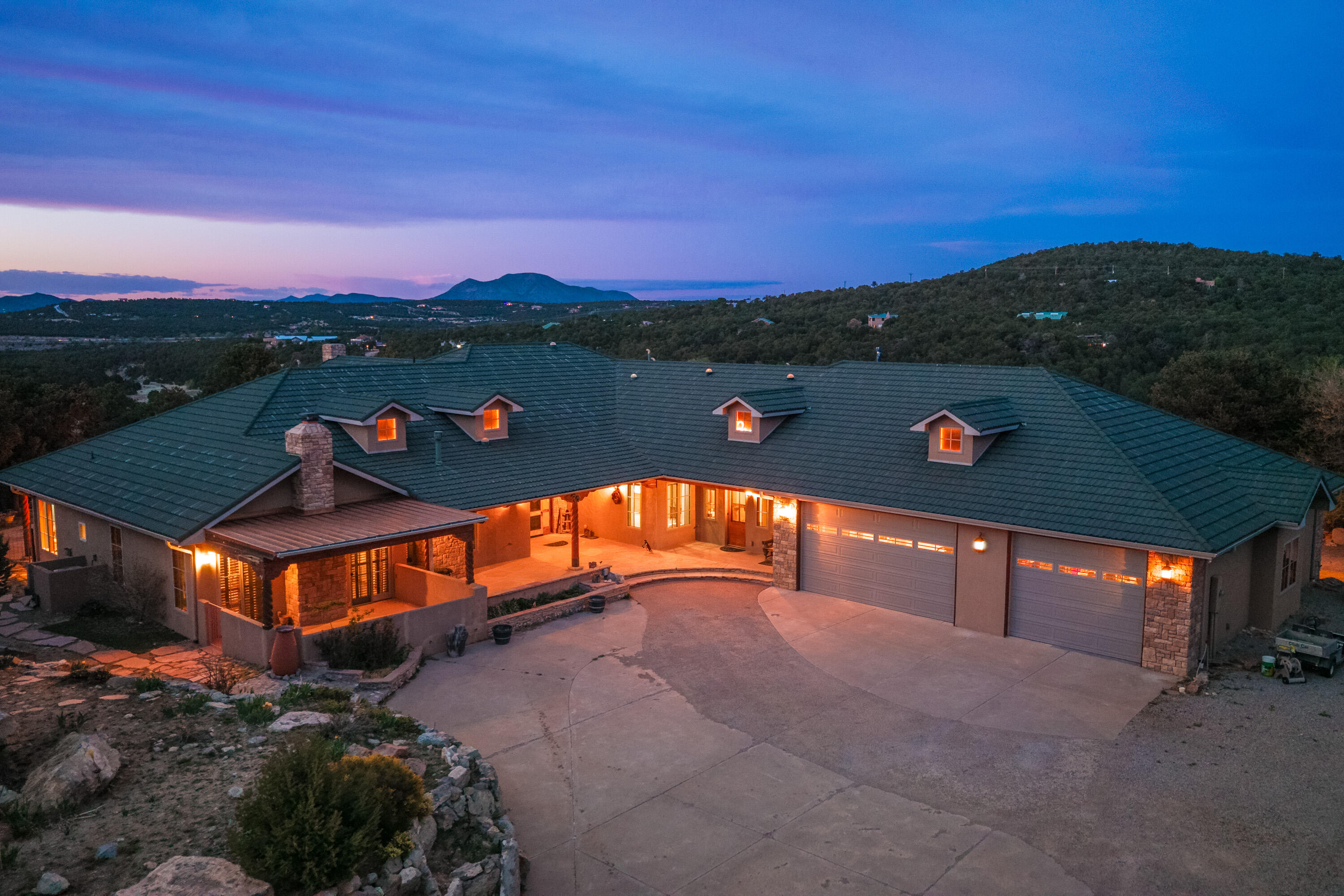 Welcome to 112 Sedillo Canyon Road, a spectacular luxury estate nestled in the East Mountains of Tijeras, New Mexico. Featuring dual primary suites, perfect for multi-generational living. As well as two 11 acre lots partially backing to national forest and open space! With one lot containing the house, the guest house and a 9 stall barn complete with a tack room. Two of the stalls featuring completely enclosed fencing to house horses, goats, or chickens. Leaving the other 11 acres for a family compound or pasture land, the possibilities are endless! No HOA! This custom-designed property seamlessly blends upscale living with exquisite natural surroundings, offering panoramic mountain views and exceptional amenities for both equestrian enthusiasts and refined homeowners.
