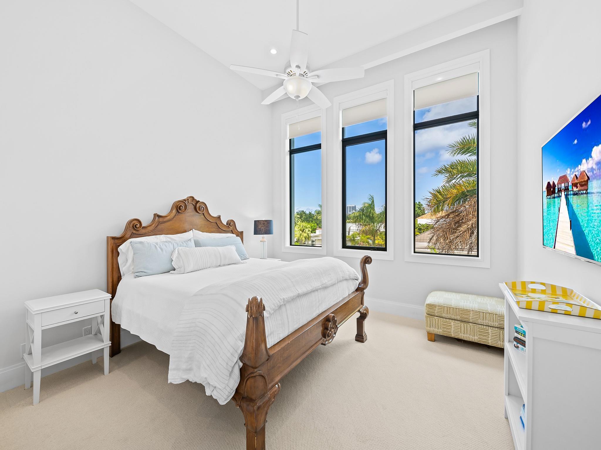 The guest suite is generously sized, filled with natural light, and includes a private en suite bathroom