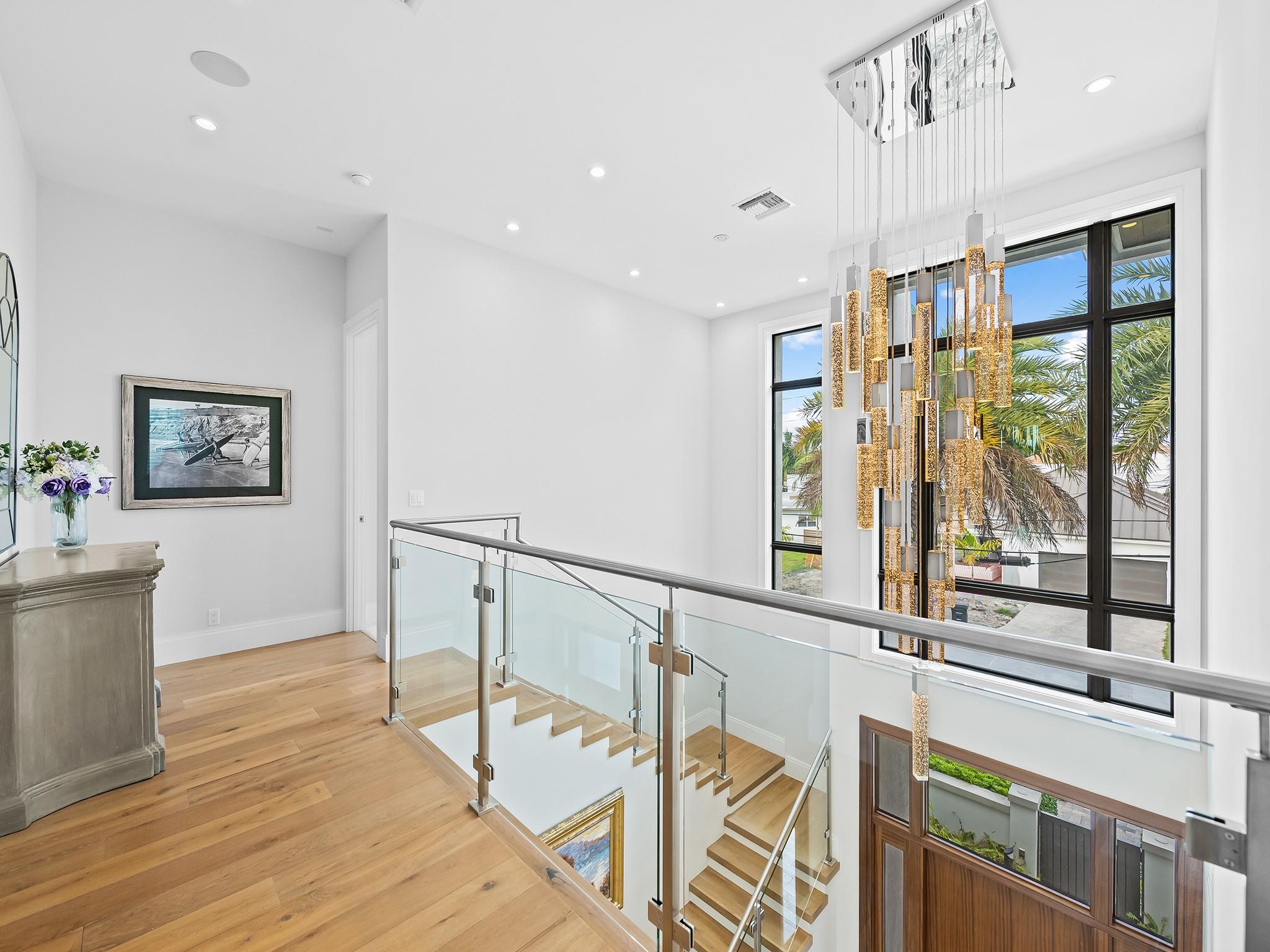 View from the upstairs landing offers a serene glimpse of the home's open, airy design, creating a perfect transition