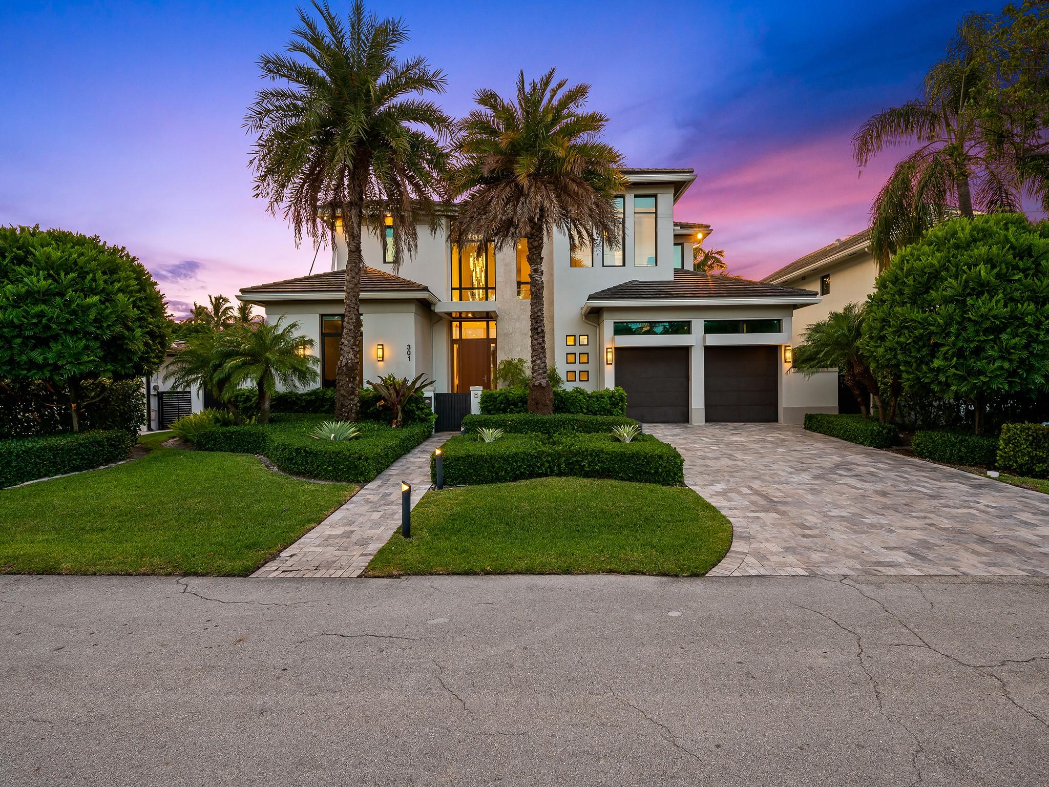 The stunner!!  The twilight view of this beautiful Las Olas home, where the glow of dusk highlights its timeless beauty and elegant charm is magical.