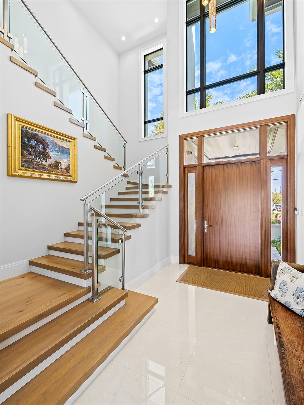 The elegantly crafted staircase to the second floor where four beautifully appointed bedrooms await, each offering a serene blend of style.