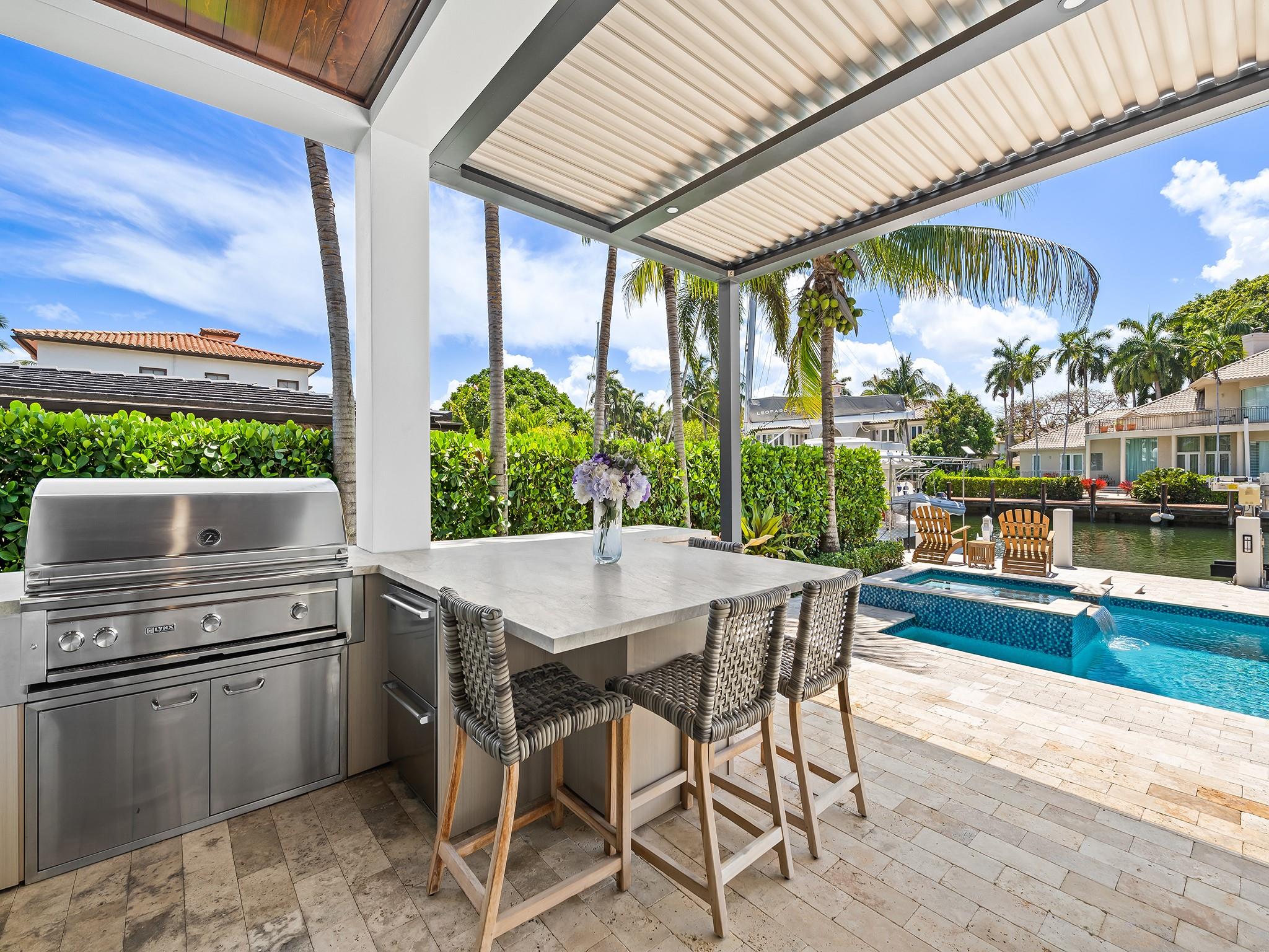 Newly built summer kitchen with Pergola X is fantastic for social gatherings.