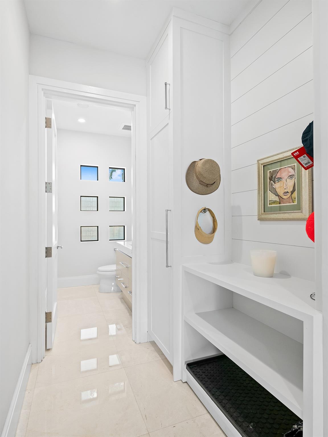 Just off the kitchen, discover ample under-stair storage along with a fully functional mudroom
