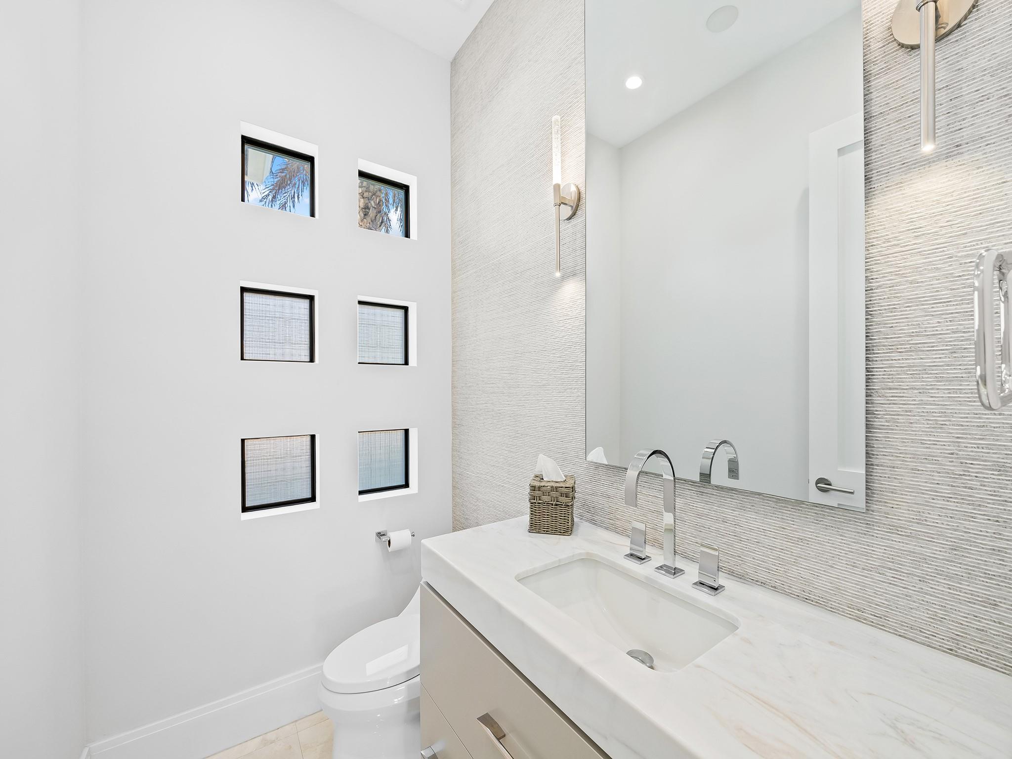 A well-placed powder room on the main floor offers convenient access for everyone.
