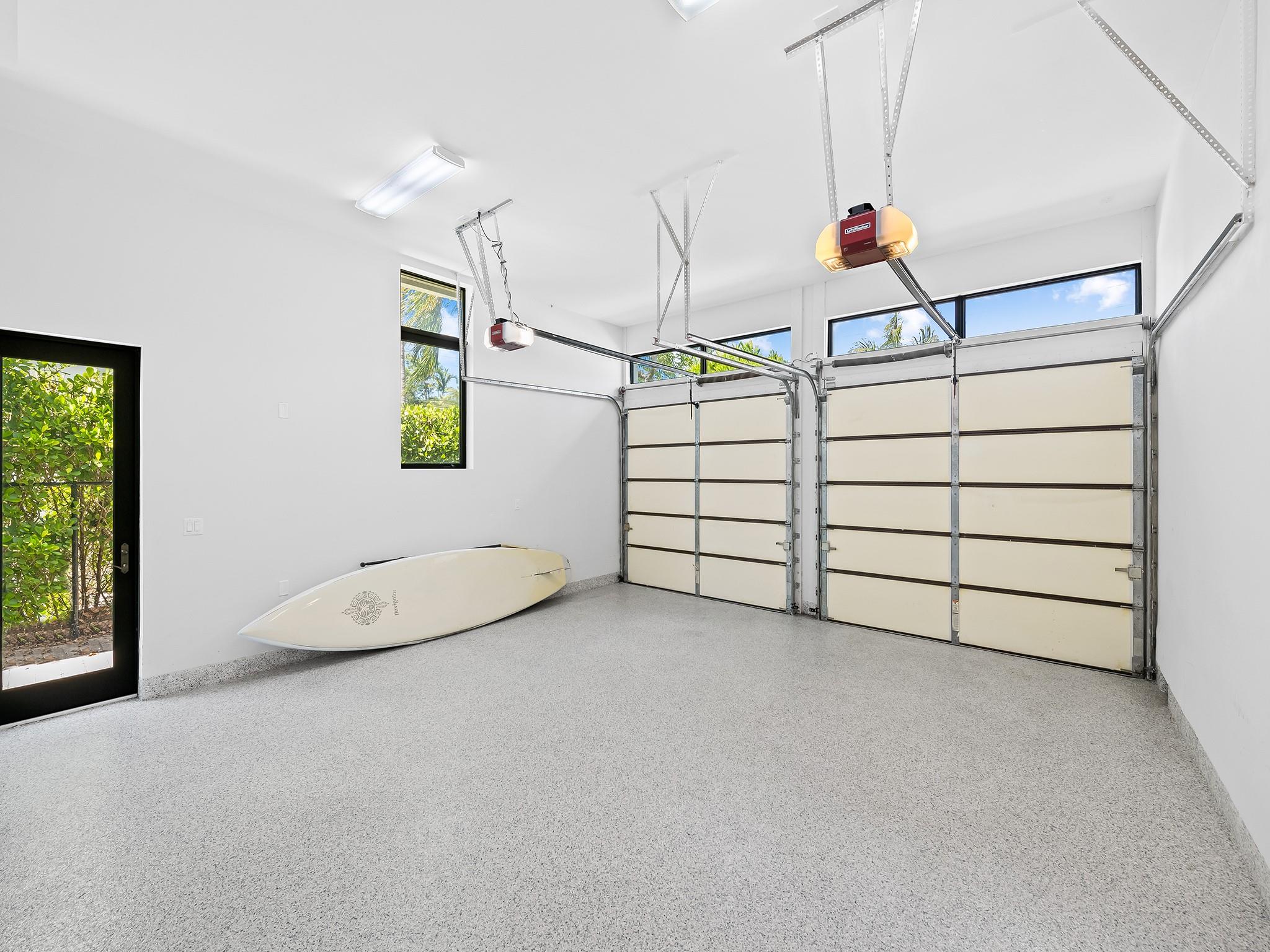 Two car garage with oversized storage closet.